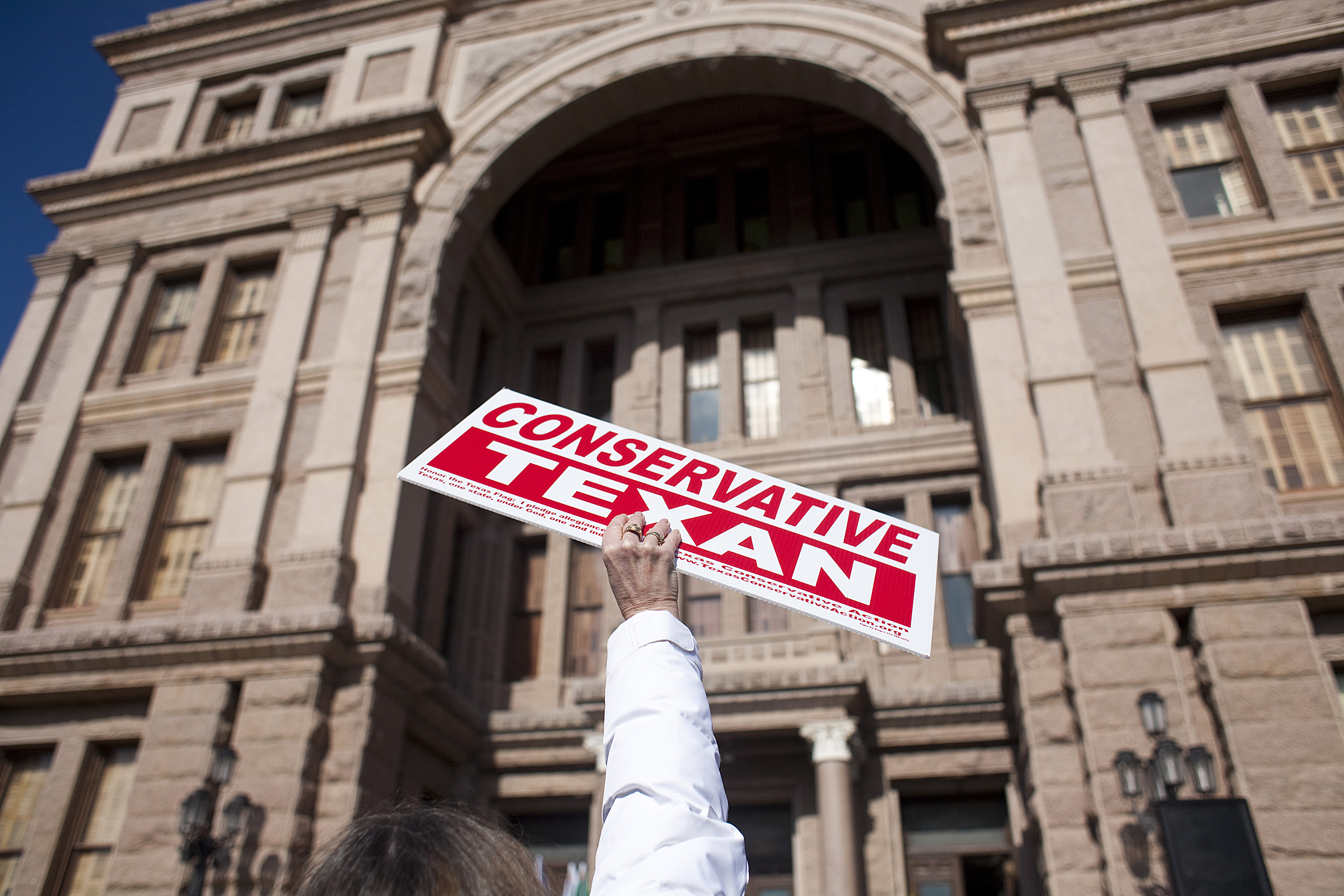 A Tea Party activist holds a sign at a rally at the Texas state capitol in Austin. CREDIT: Ben Sklar/Getty Images