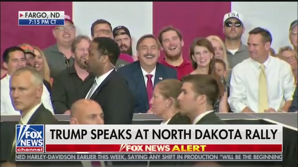MYPILLOW'S MIKE LINDELL LOOKS ON WHILE TRUMP GIVES HIM A SHOUTOUT IN FARGO. (CREDIT: SCREENGRAG)