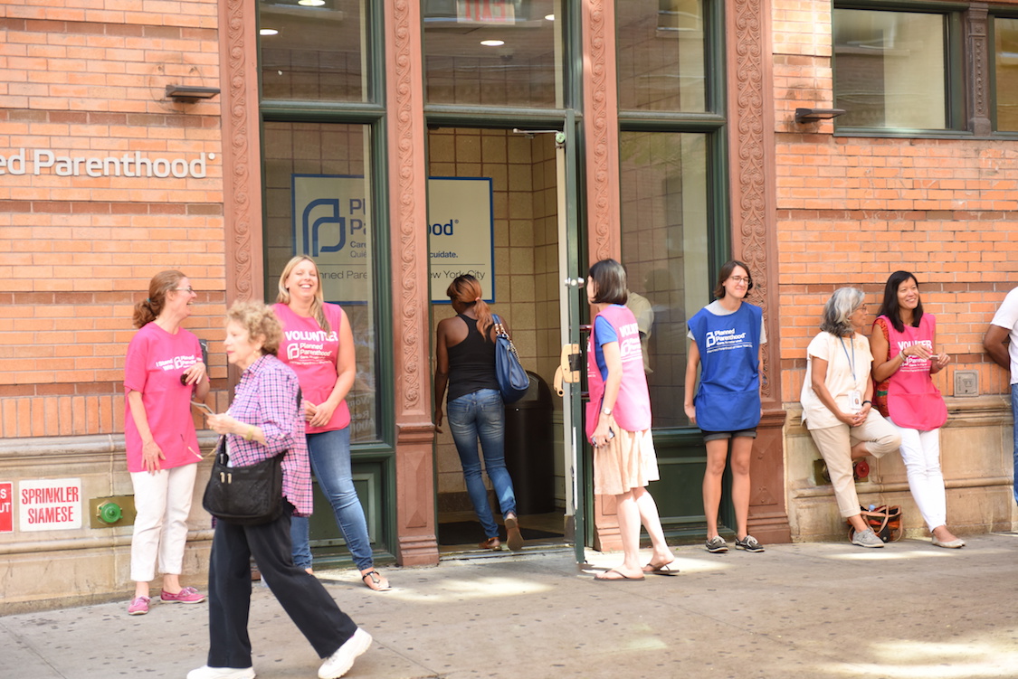 Planned Parenthood volunteers ensure access to clinic for patients with scheduled appointments during protest. CREDIT: Andy Katz/Pacific Press/LightRocket via Getty Images)