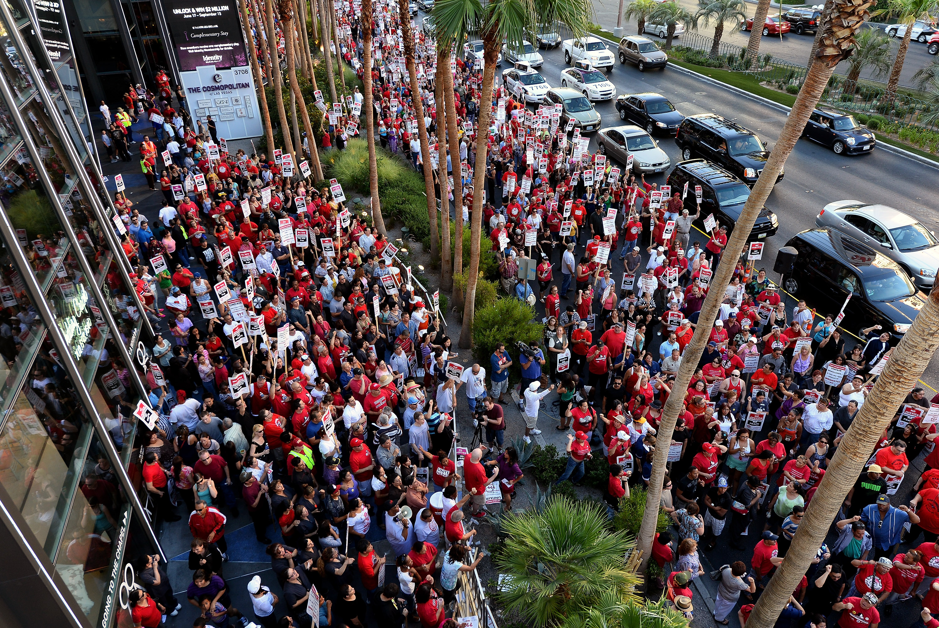 LAS VEGAS, NV - JUNE 14: Union workers picket on the Las Vegas Strip outside The Cosmopolitan of Las Vegas on June 14, 2013 in Las Vegas, Nevada. The demonstration is in response to stalled negotiations with the hotel-casino, where 2,000 members of the Culinary Workers Union have been without a contract for more than two years. (Photo by Ethan Miller/Getty Images)
