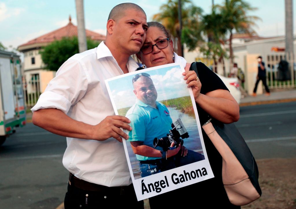 The mother and brother of journalist Angel Gahona, who died during the recent protests following an attempt by President Daniel Ortega to reform the near-bankrupt social security system, take part in a protest, at the Ruben Dario roundabout in Managua on May 10, 2018. (CREDIT: DIANA ULLOA/AFP/Getty Images)