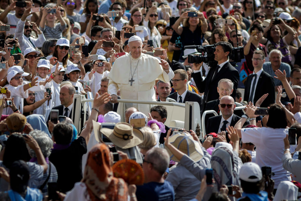 Pope Francis rides on the Popemobile through the crowd of the faithful as he arrives to celebrate his Weekly General Audience in St. Peter's Square in Vatican City, Vatican on May 30, 2018. CREDIT: Giuseppe Ciccia/Pacific Press/LightRocket via Getty Images