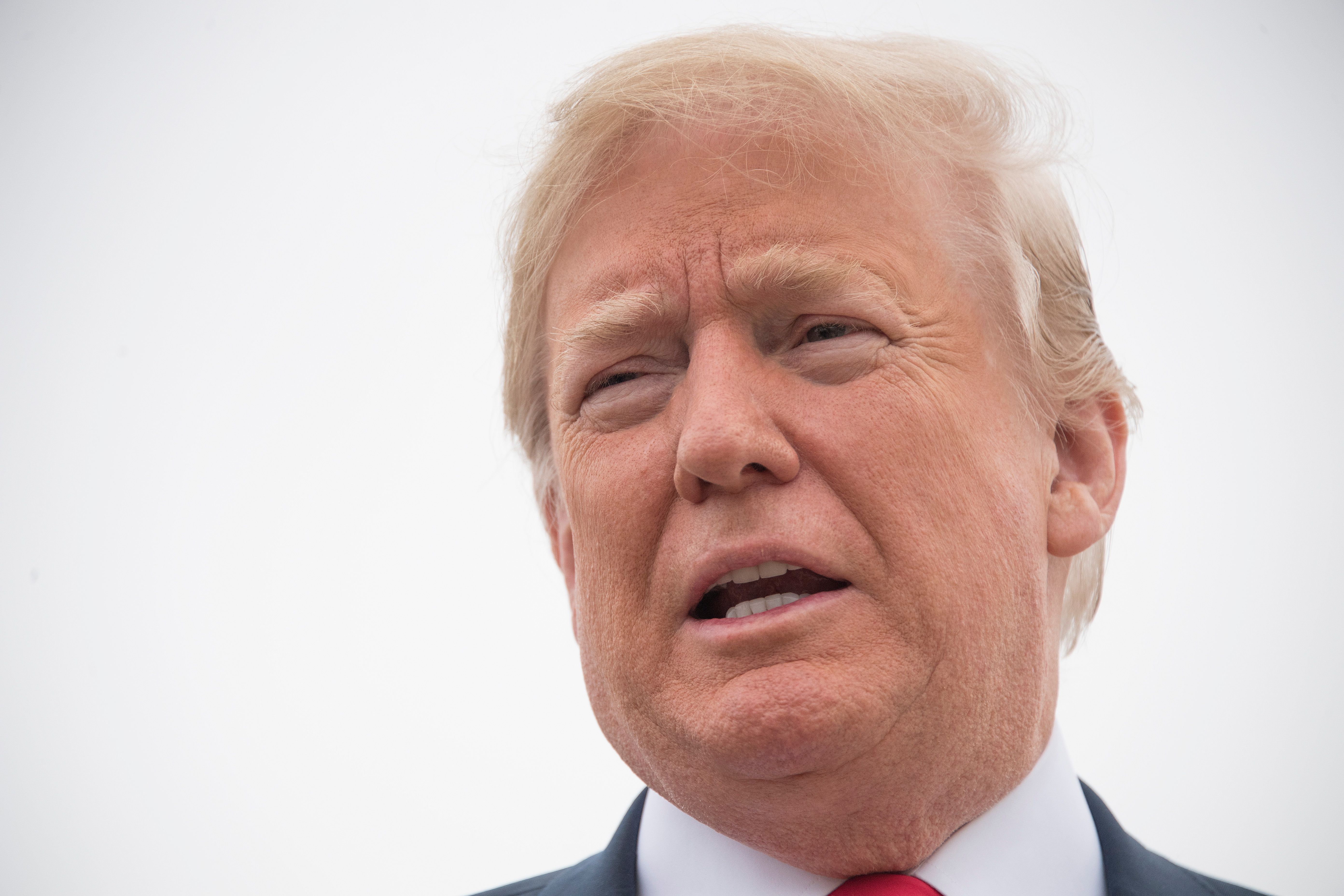 President Donald Trump talks to the press before boarding Air Force One at Andrews Air Force Base, Maryland, on May 31, 2018, as he travels to Texas for Republican fundraisers. CREDIT: Jim Watson/AFP/Getty Images.