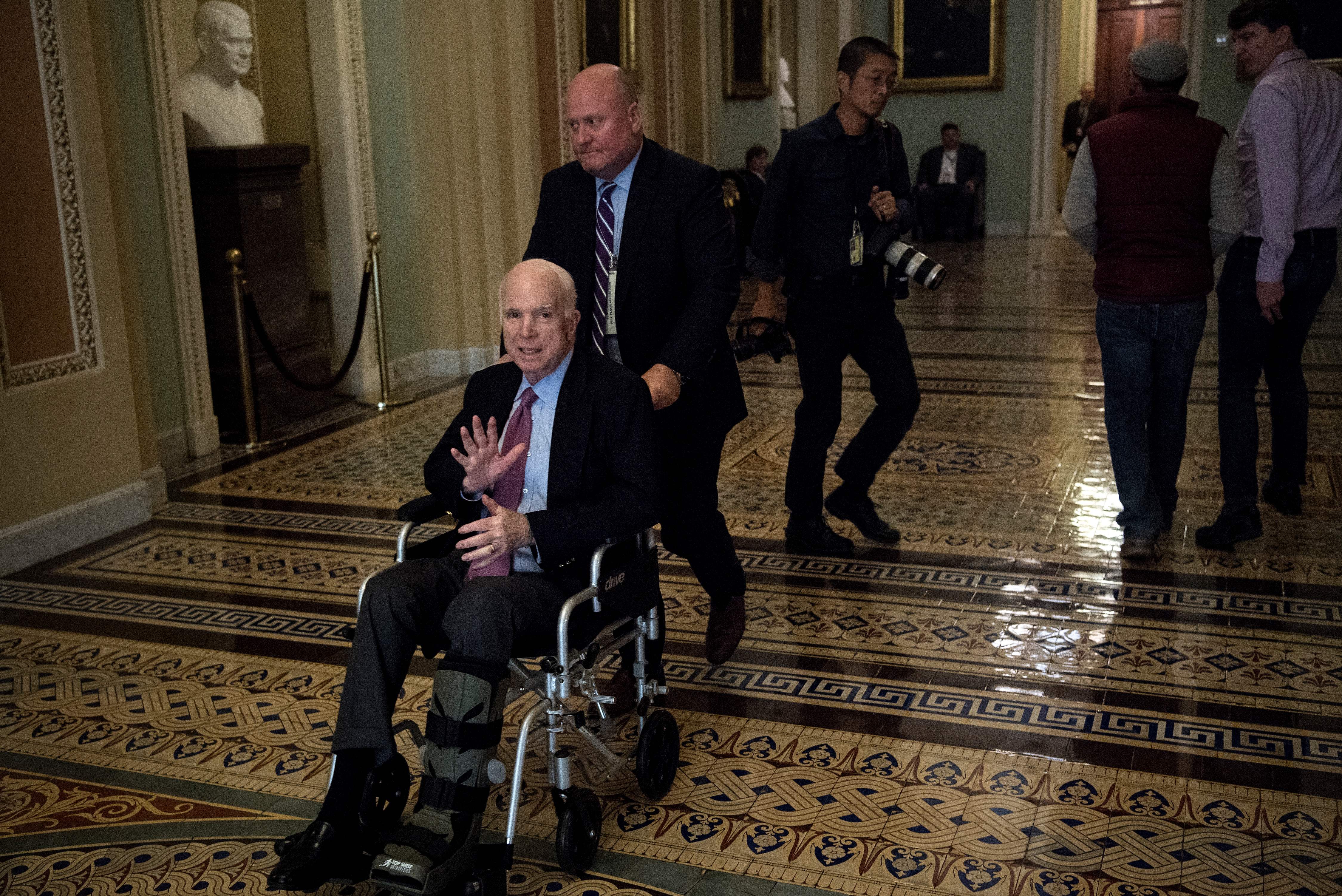 Senator John McCain (R-AZ) uses a wheelchair on Capitol Hill December 1, 2017 in Washington, DC (BRENDAN SMIALOWSKI/AFP/Getty Images)
