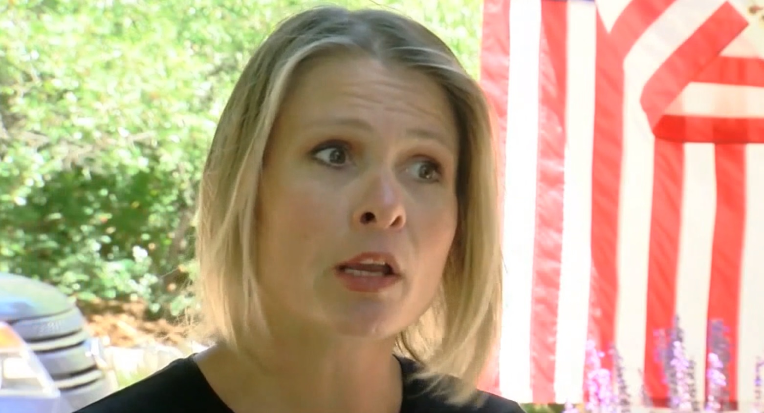 Shauna Johnson faces misdemeanor charges for writing a protest message in chalk outside Rep. Buck's Colorado office. (Credit: Screenshot, Denver7 ABC)