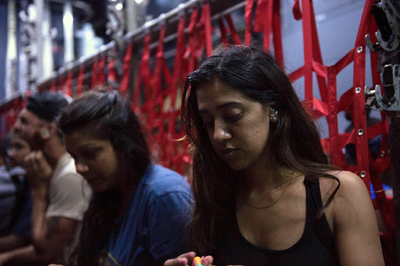 A student from the Ross University School of Medicine in Portsmouth, Dominica prepares to be evacuated from the island after Hurricane Maria struck, September 23, 2017. CREDIT: Technical Sergeant Shawn Nickel, United States Air Force