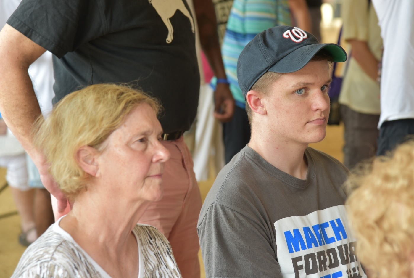 Ginge Savigne (left) and her grandson Michael McCabe listen to speakers at a Poor People's Campaign rally on Monday. (ThinkProgress Photo -- Sam Fulwood III)