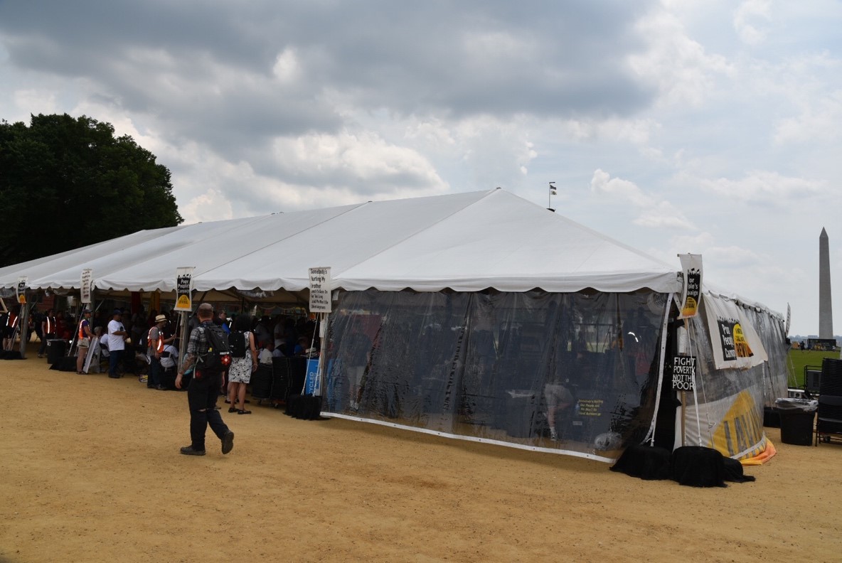 The Poor People’s Campaign rally Monday on the National Mall in Washington, D.C. drew a crowd that could be contained in a solitary tent in the shadow of the Washington Monument. Unlike the 1968 campaign which filled the Mall’s green space. (Think Progress photo – Sam Fulwood III)