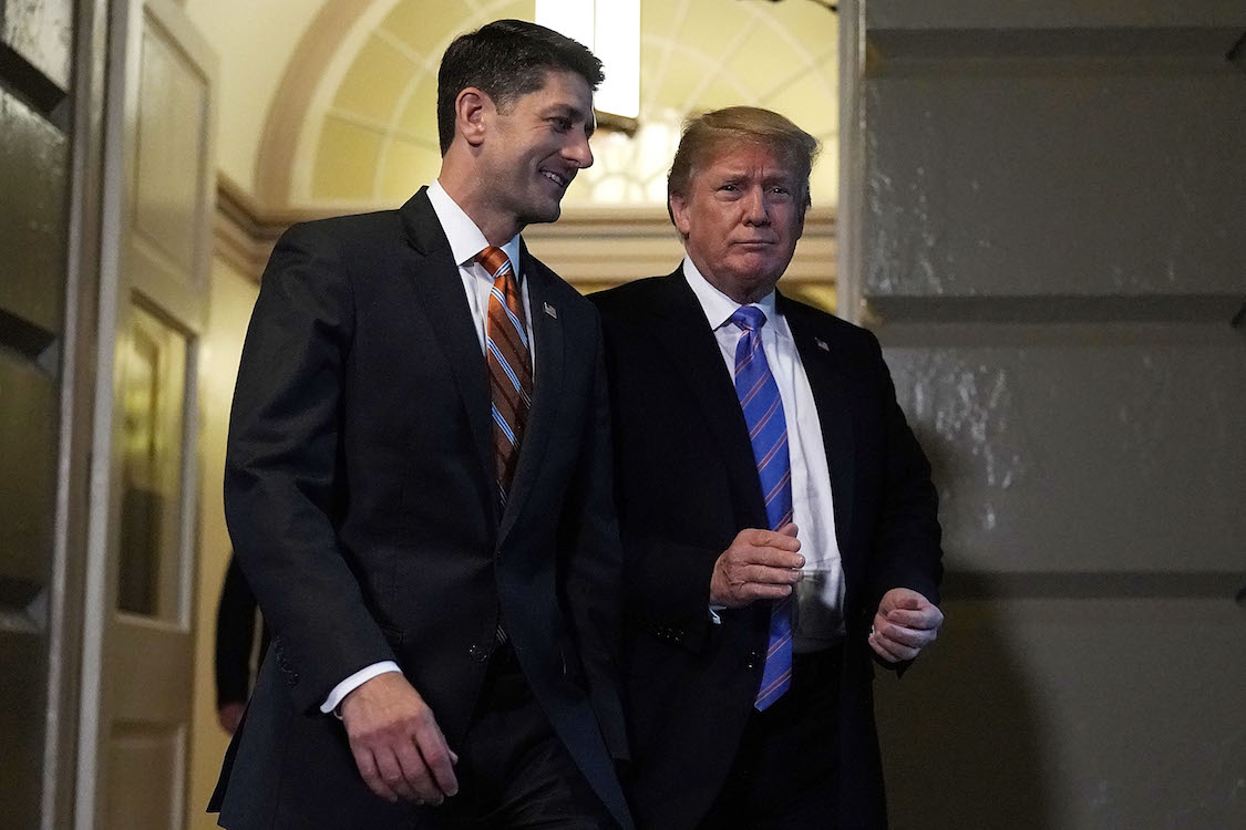 Accompanied by Speaker of the House Rep. Paul Ryan (R-WI) U.S. President Donald Trump arrives at a meeting with House Republicans at the U.S. Capitol June 19, 2018 in Washington, DC. (CREDIT: Alex Wong/Getty Images)