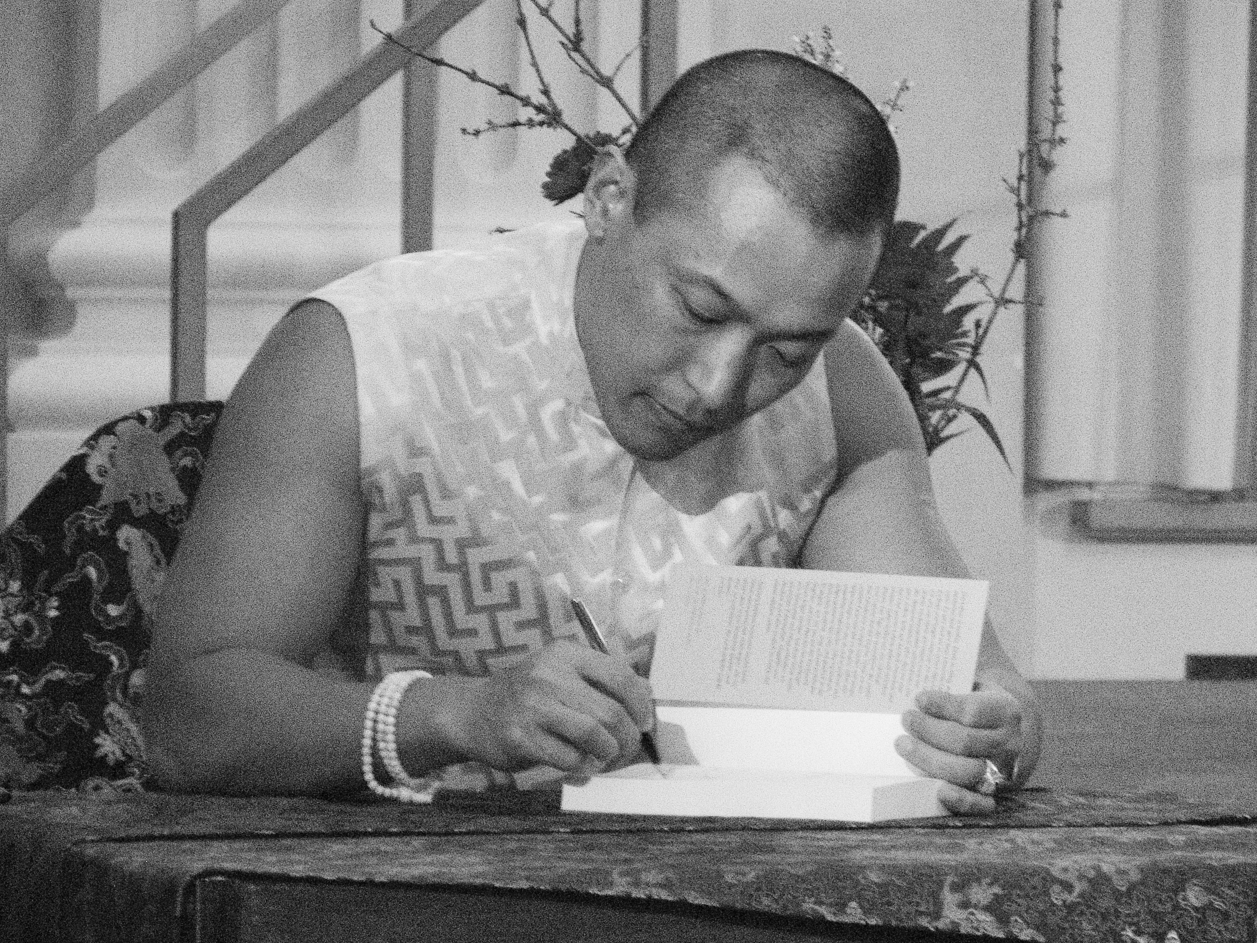Sakyong Mipham sings a book during a program in Munich, Germany, on Feb. 2, 2007. CREDIT: Robertivanc via Flickr