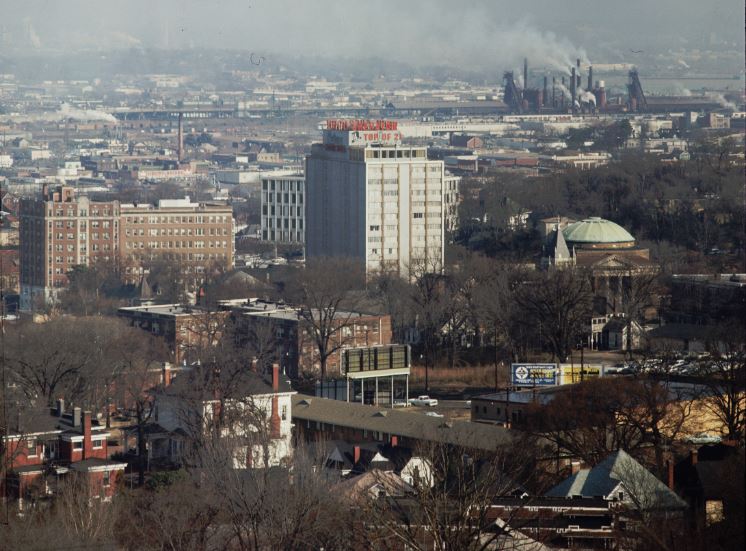 A view of the city of Birmingham, Alabama, showing its downtown area and a number of smoking steel mills. CREDIT: Charles Rotkin/Corbis/VCG via Getty Images
