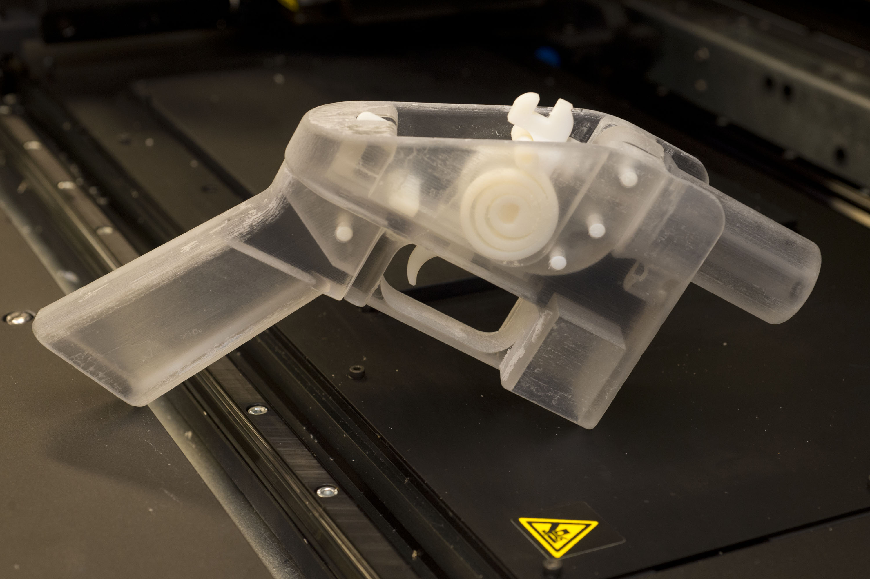 Daniel Southwick shows off a gun made by a 3D printer. It's been modified so it can't shoot bullets, but its creation raises disturbing questions. (Keith Beaty/Toronto Star via Getty Images)