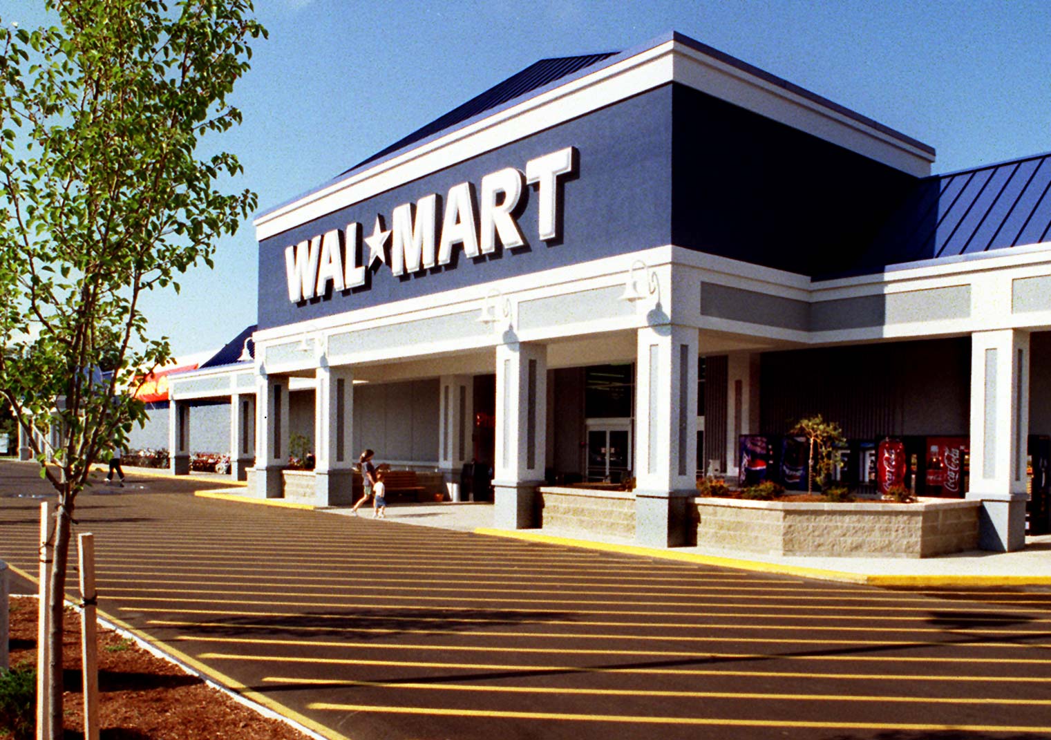 Walmart patents technology to listen in on workers, the latest company to move toward increased surveillance of employees, a detrimental practice. (Photo credit: Gordon Chibroski/ Portland Press Herald via Getty Images)