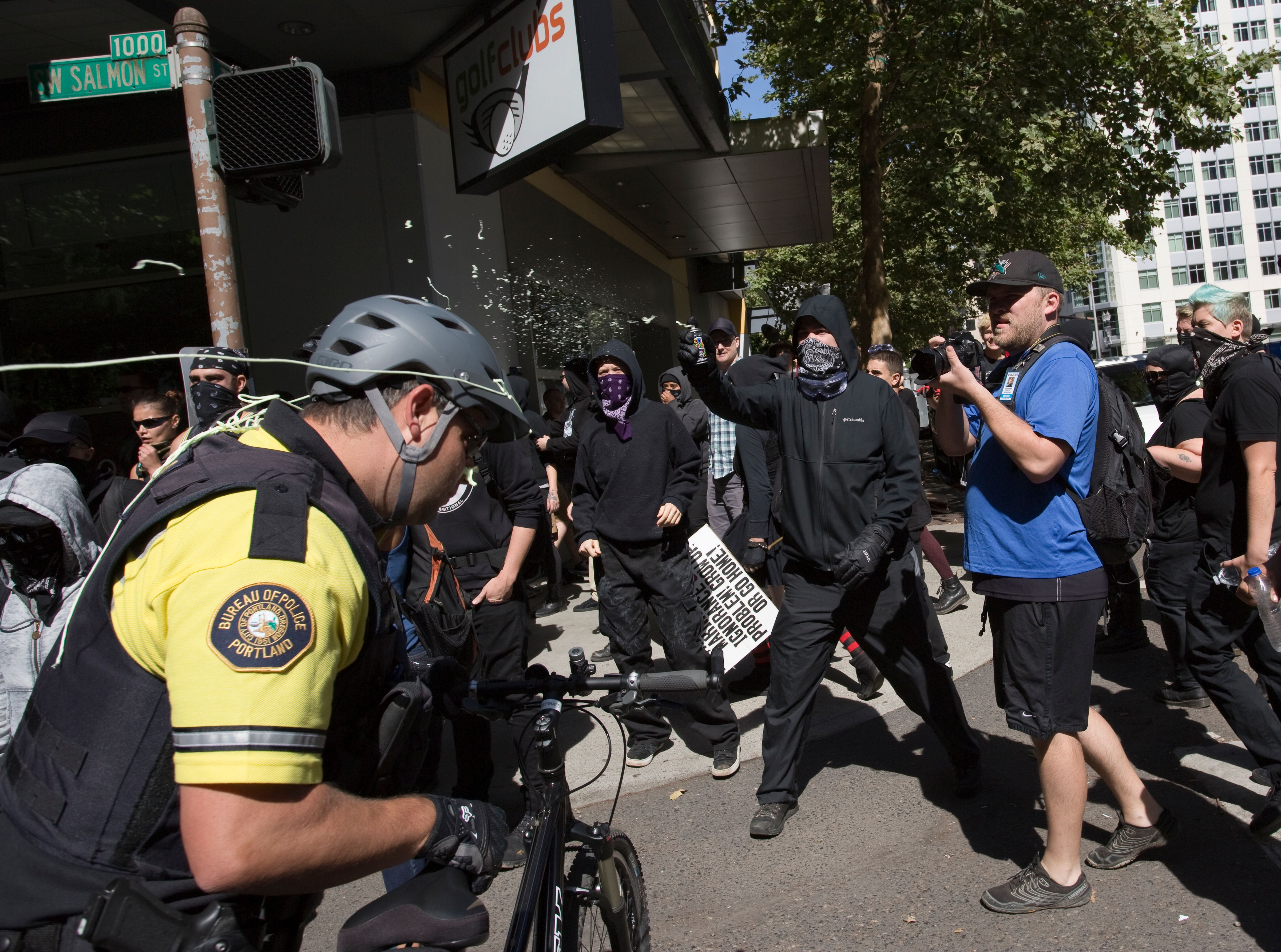 Antifa spray silly string at police during a protest to oppose the right wing group "The Patriot Prayer Movement," that was having a rally in downtown Portland, Oregon on September 10, 2017.
Several hundred protesters descended in to downtown Portland to oppose the right-wing group. (NATALIE BEHRING/AFP/Getty Images)