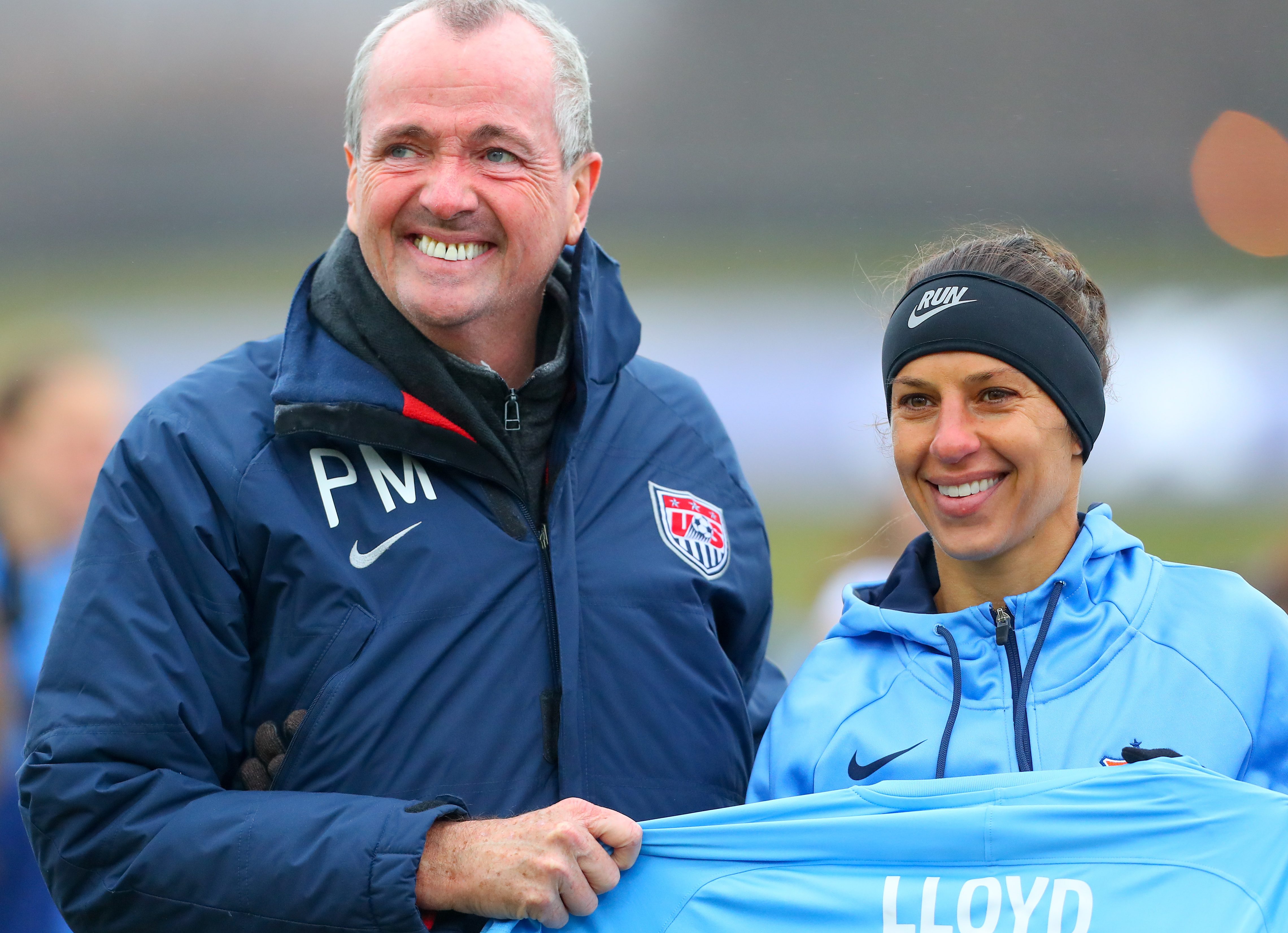 PISCATAWAY, NJ - APRIL 15: Sky Blue FC midfielder Carli Lloyd (10) poses for a photo with New Jersey Governor Phil Murphy in recognition of her 100th Goal prior to the first half of the National Womens Soccer League game between Sky Blue FC and Seattle Reign FC on April 15, 2018, at Yurcak Field in Piscataway, NJ. (Photo by Rich Graessle/Icon Sportswire via Getty Images)