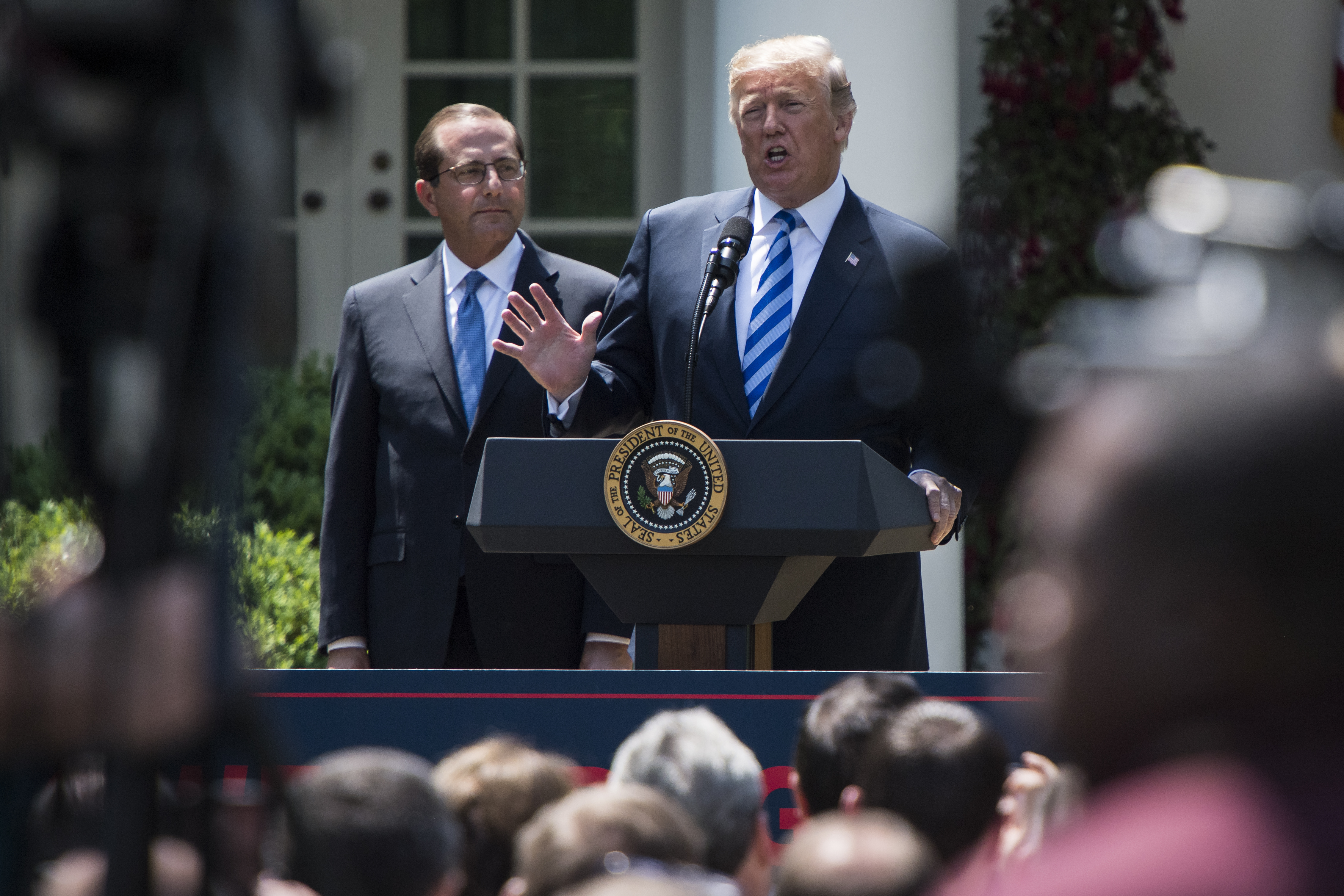 President Donald J. Trump speaks, with Health and Human Services Secretary Alex Azar by his side, during an event on lowering drug prices in the Rose Garden of the White House on Friday, May 11, 2018 in Washington, DC. (CREDIT: Botsford/The Washington Post via Getty Images)