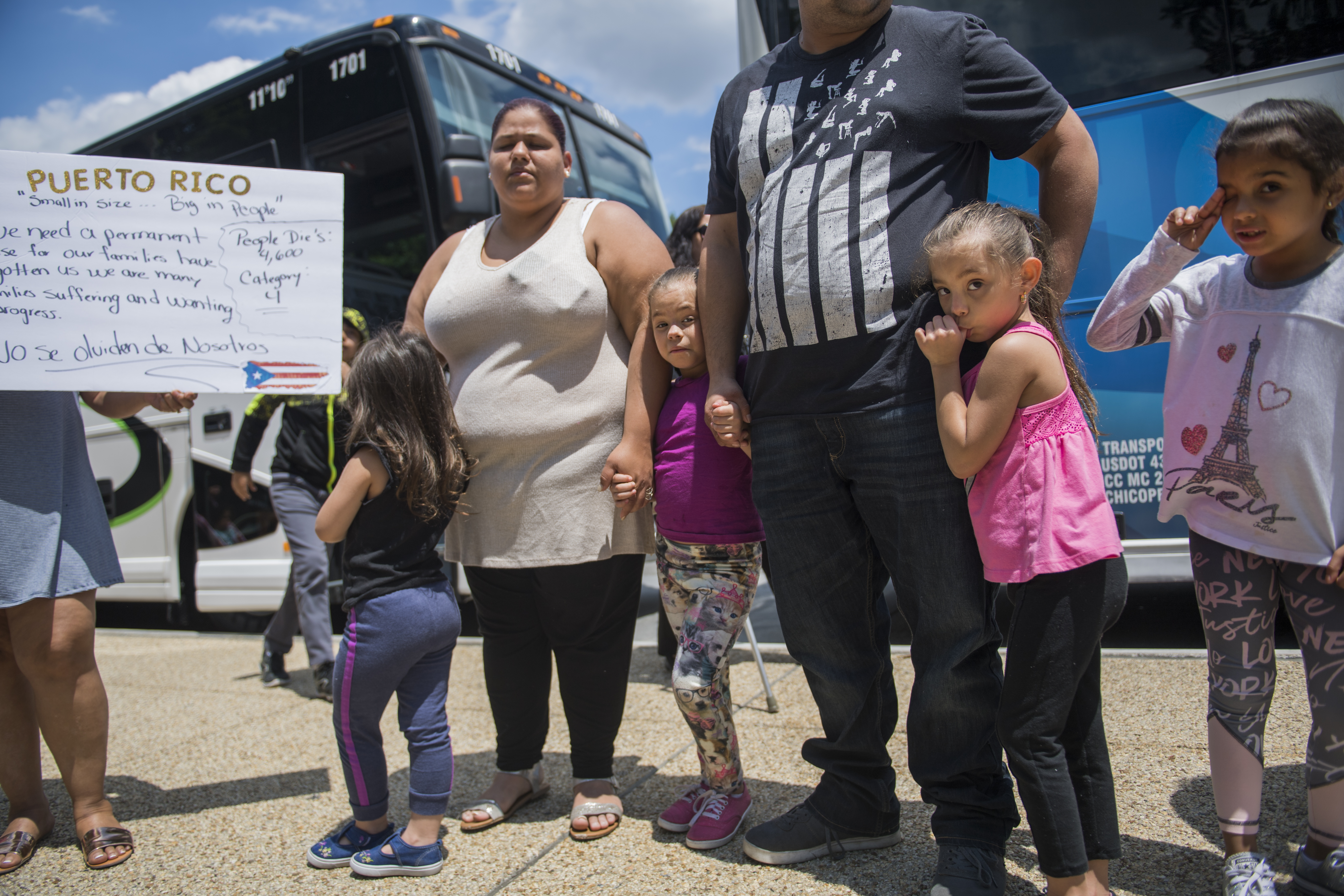 Puerto Ricans who were displaced by Hurricane Maria, arrive in buses from western Massachusetts on First St., NE, on June 6, 2018, Washington, D.C. (CREDIT: Tom Williams/CQ Roll Call)