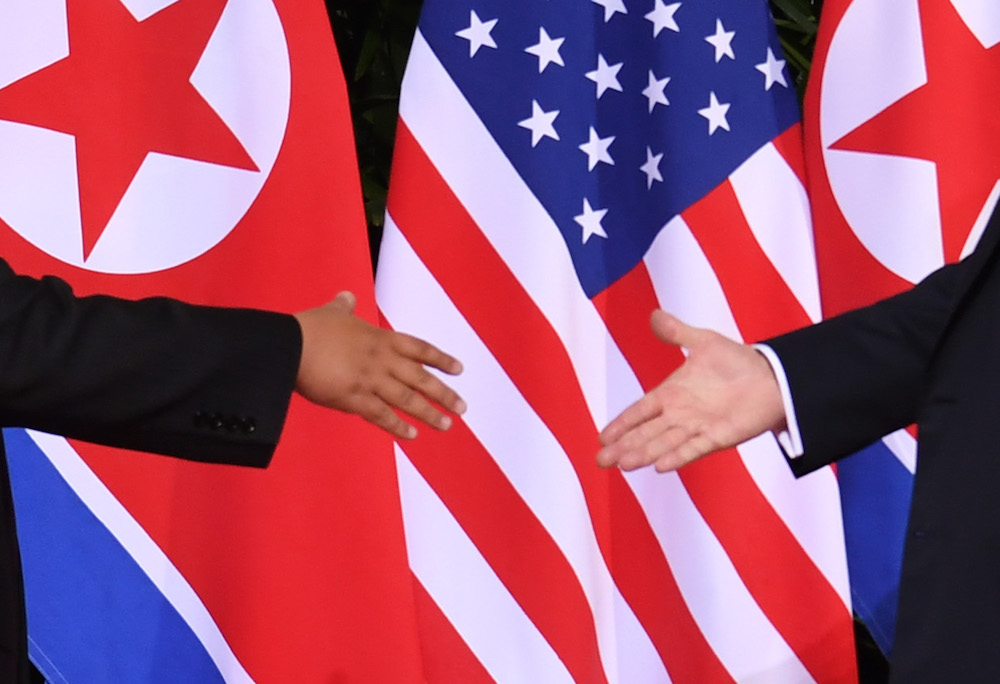 An incompetent and overmatched authoritarian leader shakes hands with North Korean dictator Kim Jong Un in Singapore in June of 2018. Credit: SAUL LOEB/AFP/Getty Images