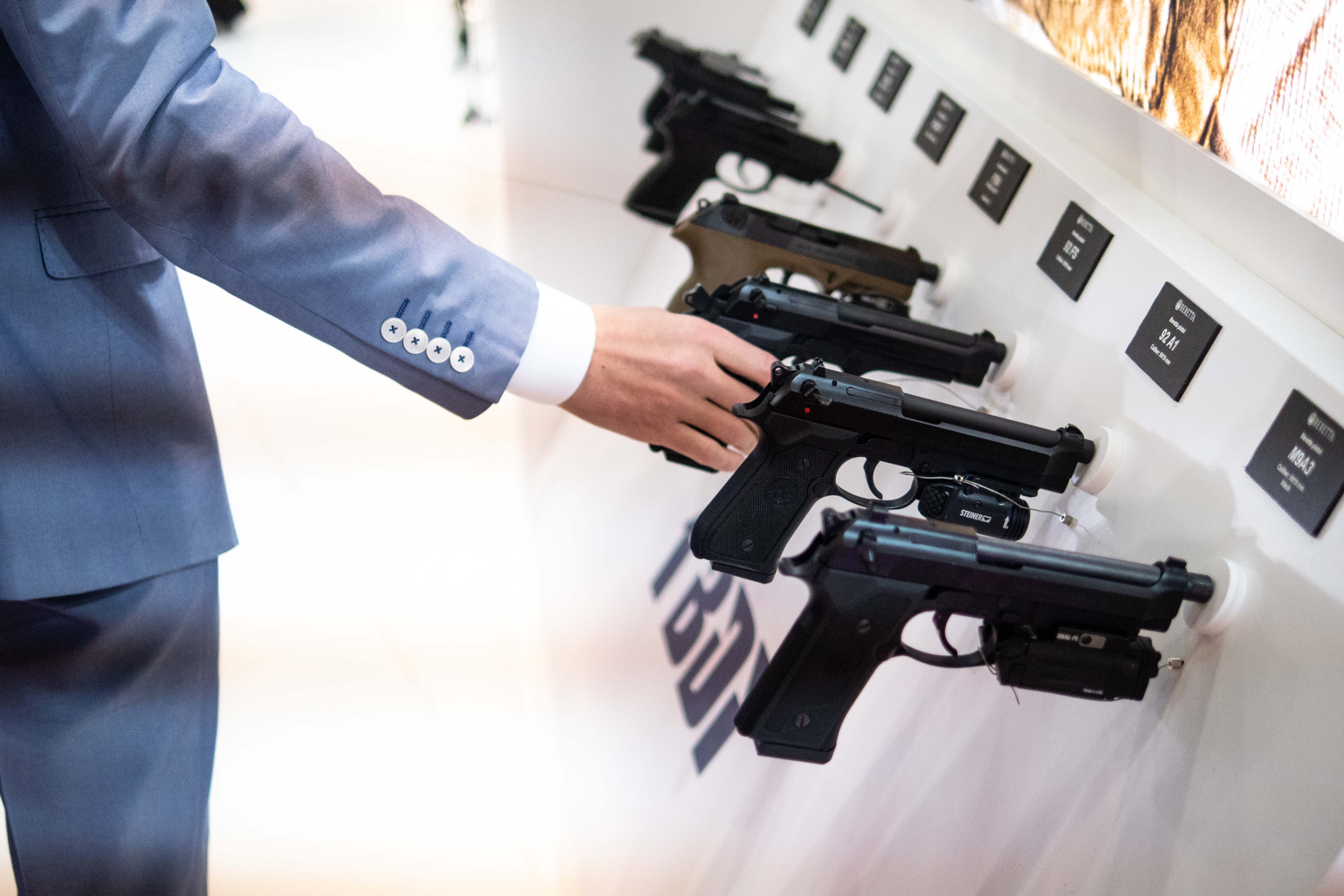 Attendee tests guns at the Eurosatory 2018 Show, on June 12, 2018 in Villepinte, France. CREDIT: Christophe Morin/IP3/Getty Images
