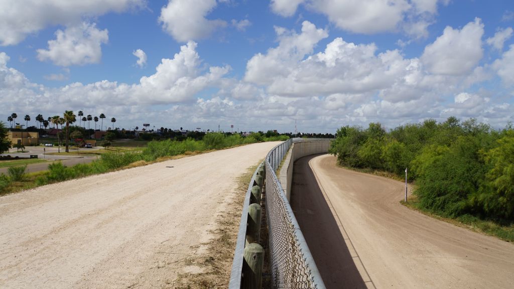A wall along one of the several layers of the US-Mexico border fencing in the border town of McAllen, Texas on June 14, 2018. CREDIT: Gianrigo MARLETTA / AFP / GETTY IMAGES