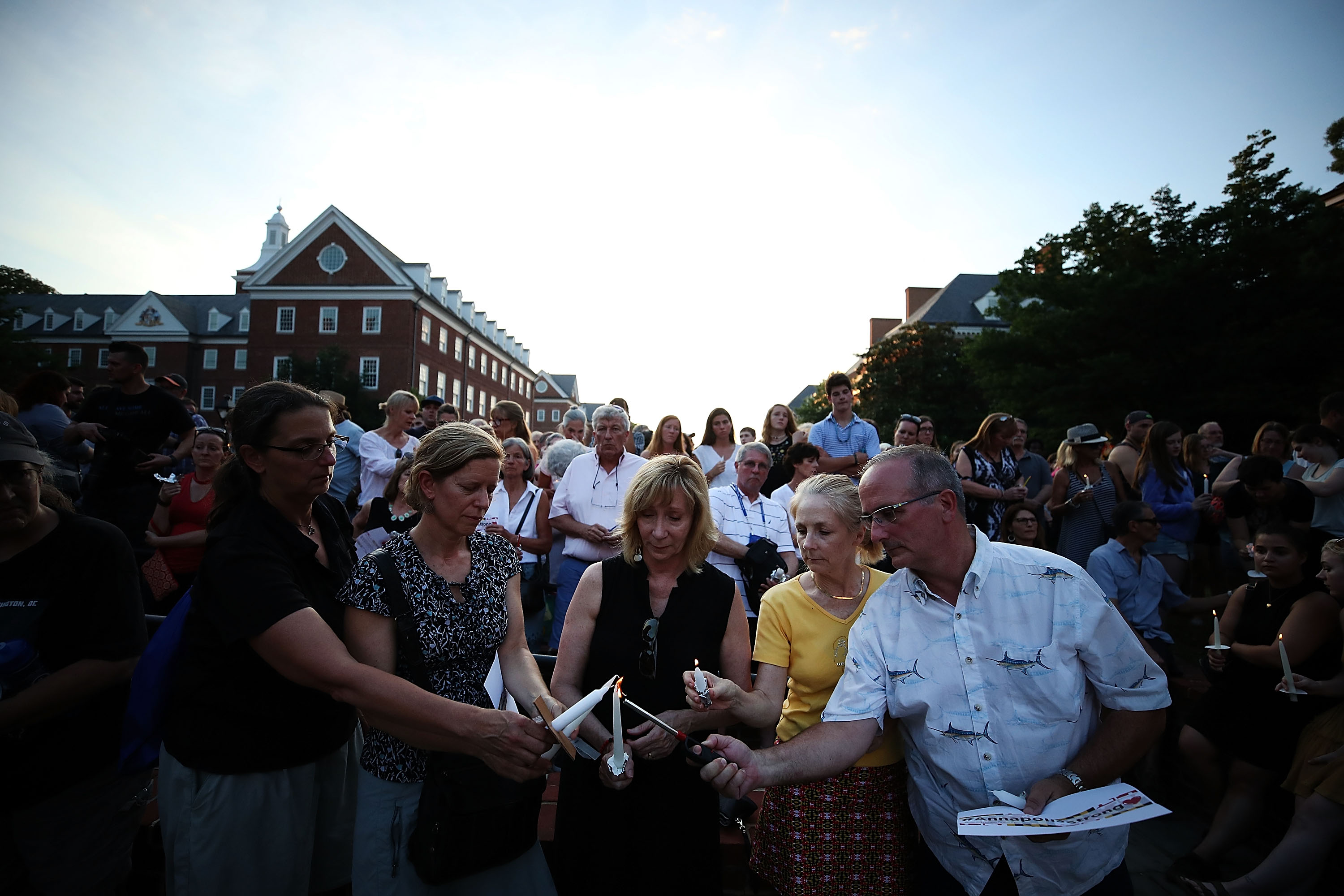 People light candles during a candlelight vigil to honor the 5 people were shot and killed at the Capital Gazette newpaper yesterday, on June 29, 2018 in Annapolis, Maryland. CREDIT: Mark Wilson/Getty Images