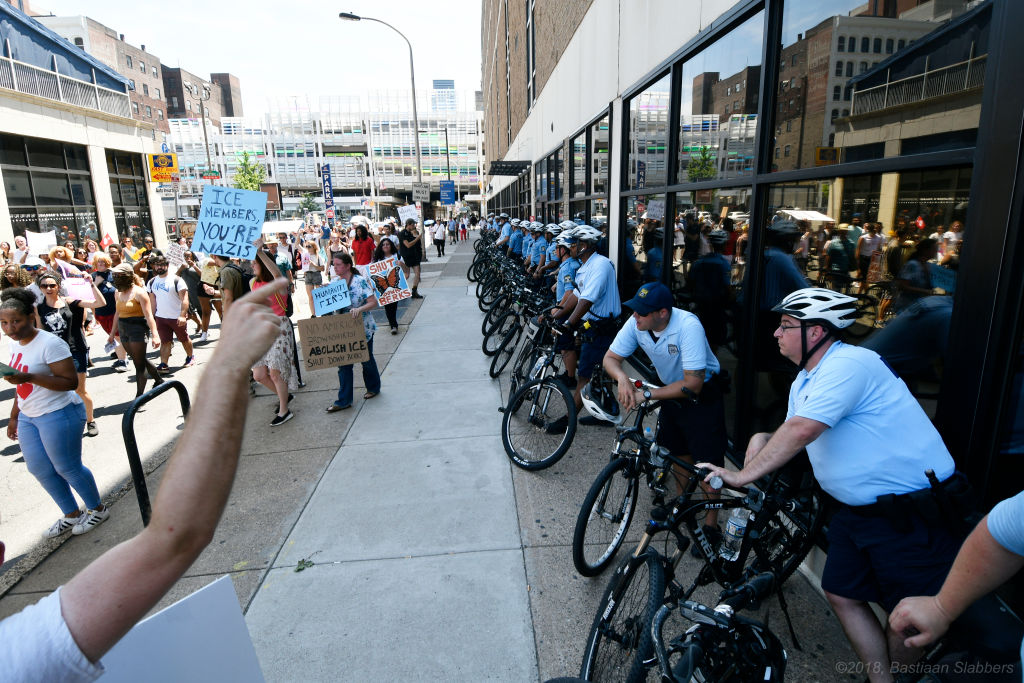Police officers face off with protesters at a local Dept of Homeland Security Immigration Field Office, in Philadelphia, PA, on June 30, 2018. (CREDIT: Bastiaan Slabbers/NurPhoto via Getty Images)