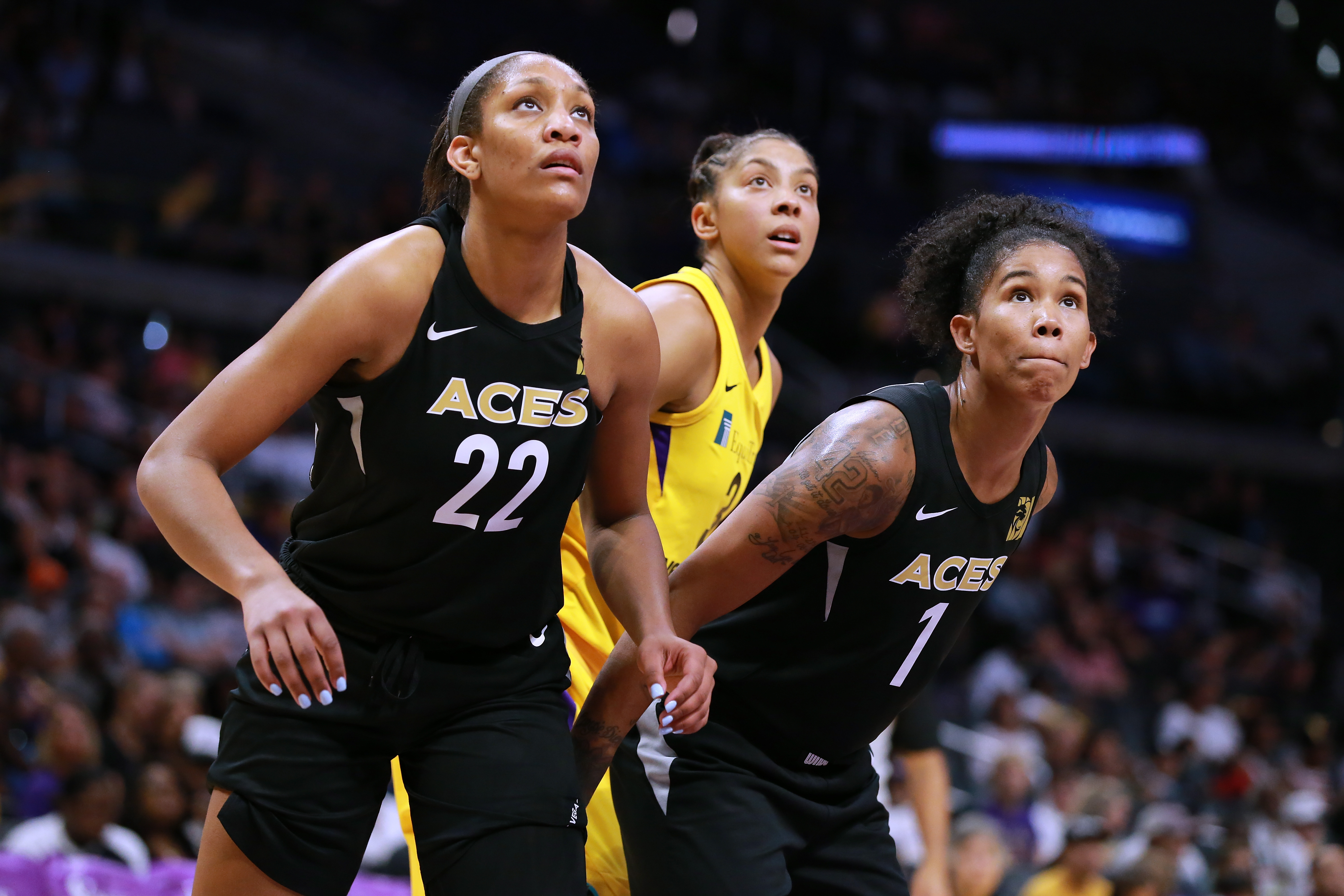 LOS ANGELES, CA - JULY 01: A'ja Wilson #22 and Tamera Young #1 of the Las Vegas Aces box out Candace Parker #3 of the Los Angeles Sparks during a WNBA basketball game at Staples Center on July 1, 2018 in Los Angeles, California. (Photo by Leon Bennett/Getty Images)