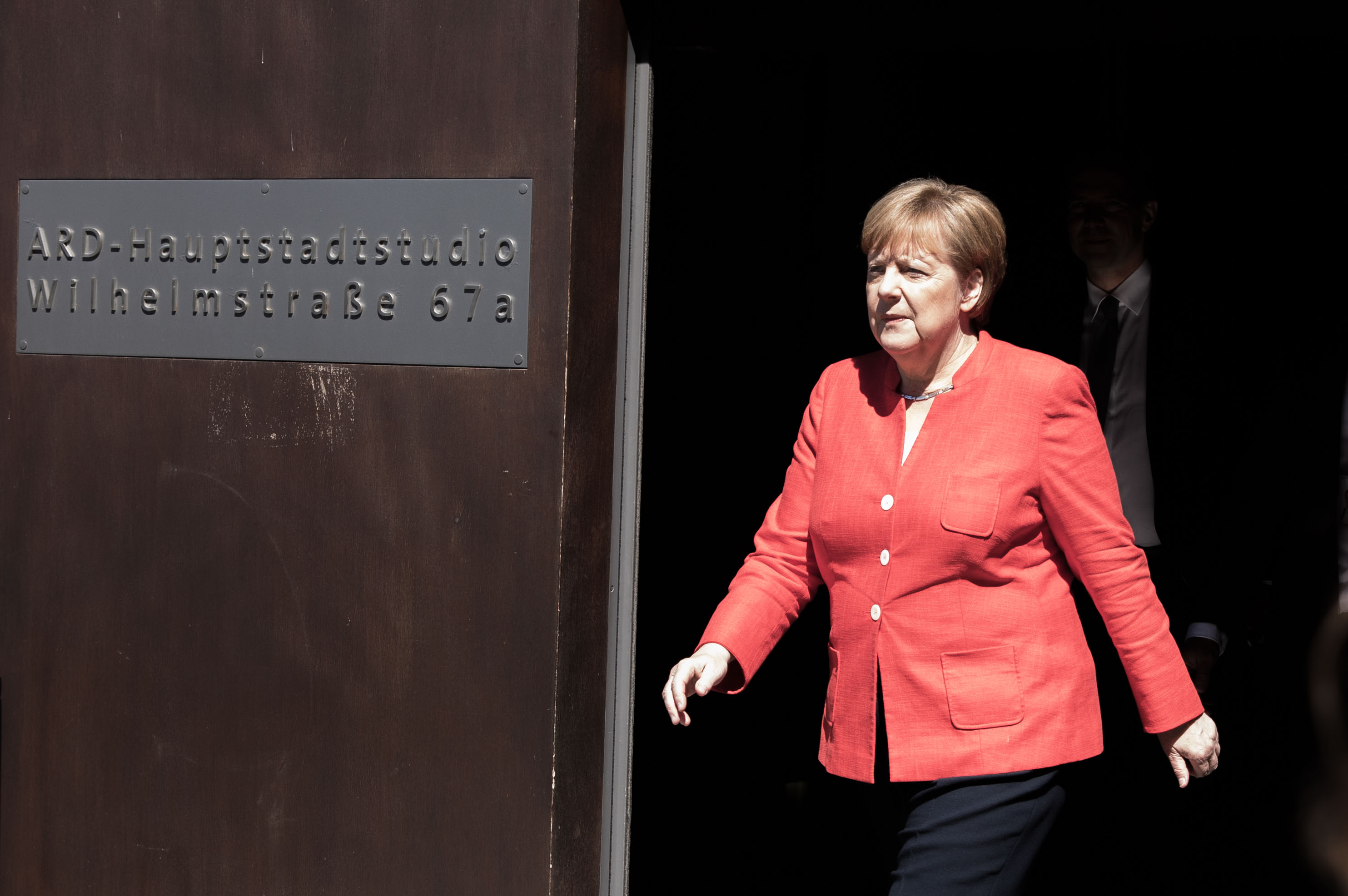 Angela Merkel leaves the studios of German public television station ARD, on July 4, 2018 in Berlin, after having recorded an interview to be broadcast later in the day. CREDIT: Omer MESSINGER/AFP/Getty Images.