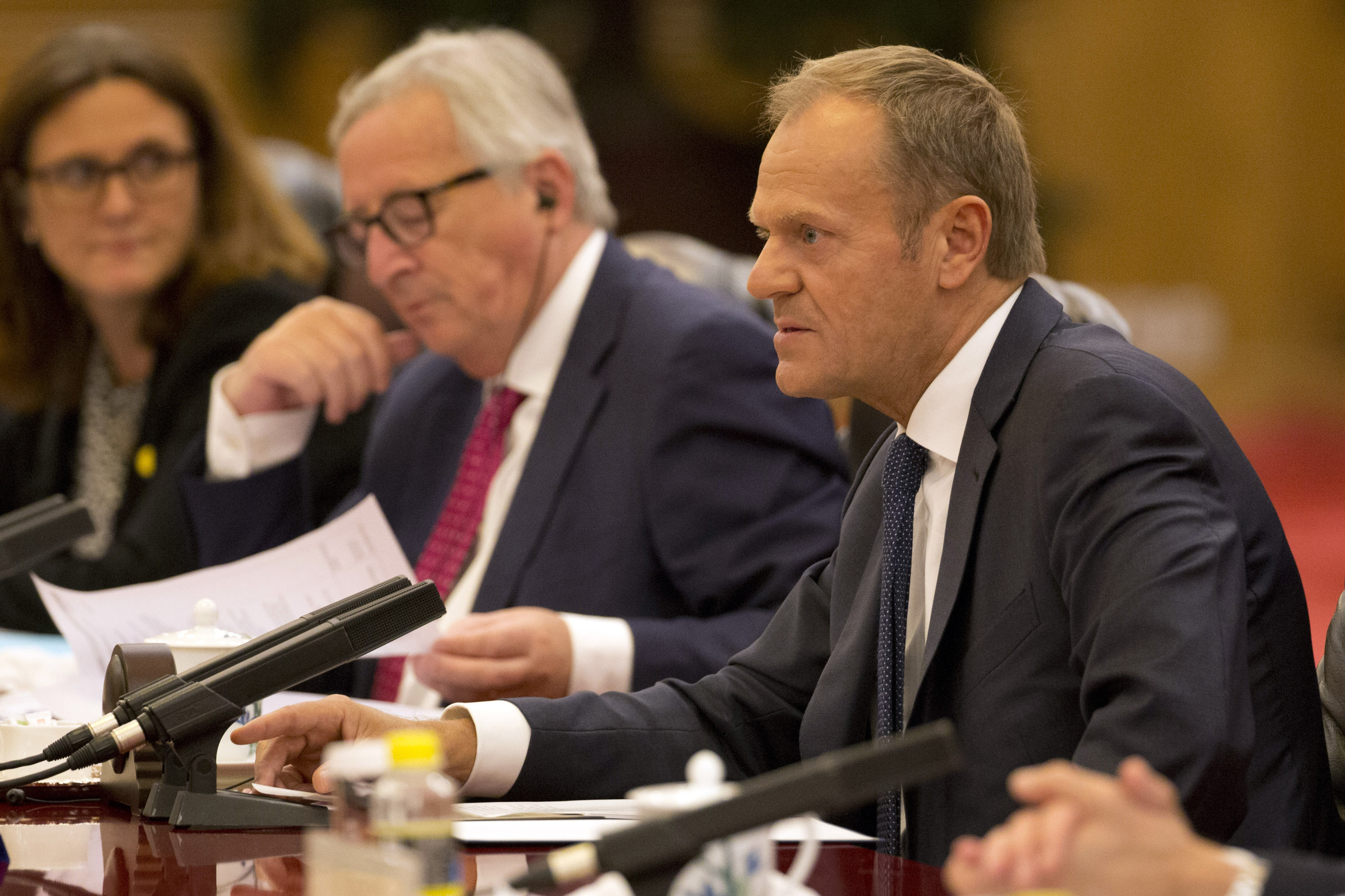 European Council President Donald Tusk, right speaks near European Commission President Jean-Claude Juncker during a meeting with Chinese Premier Li Keqiang, unseen at the Great Hall of the People in Beijing, China, Monday, July 16, 2018. (Photo by Ng Han Guan,-Pool/Getty Images)