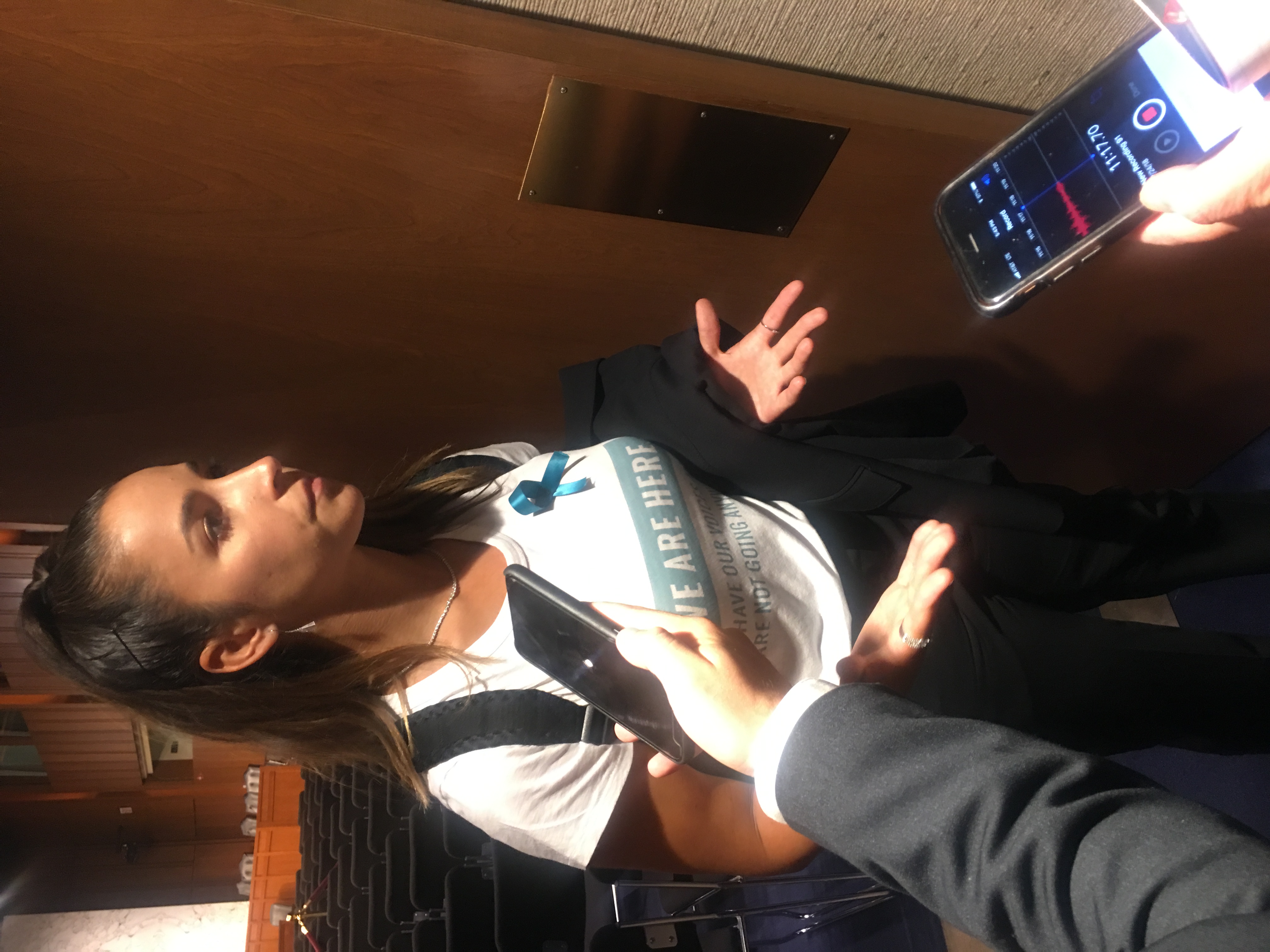 Aly Raisman talks with reporters after the senate subcommittee hearing on sex abuse in amateur sports. CREDIT: Lindsay Gibbs