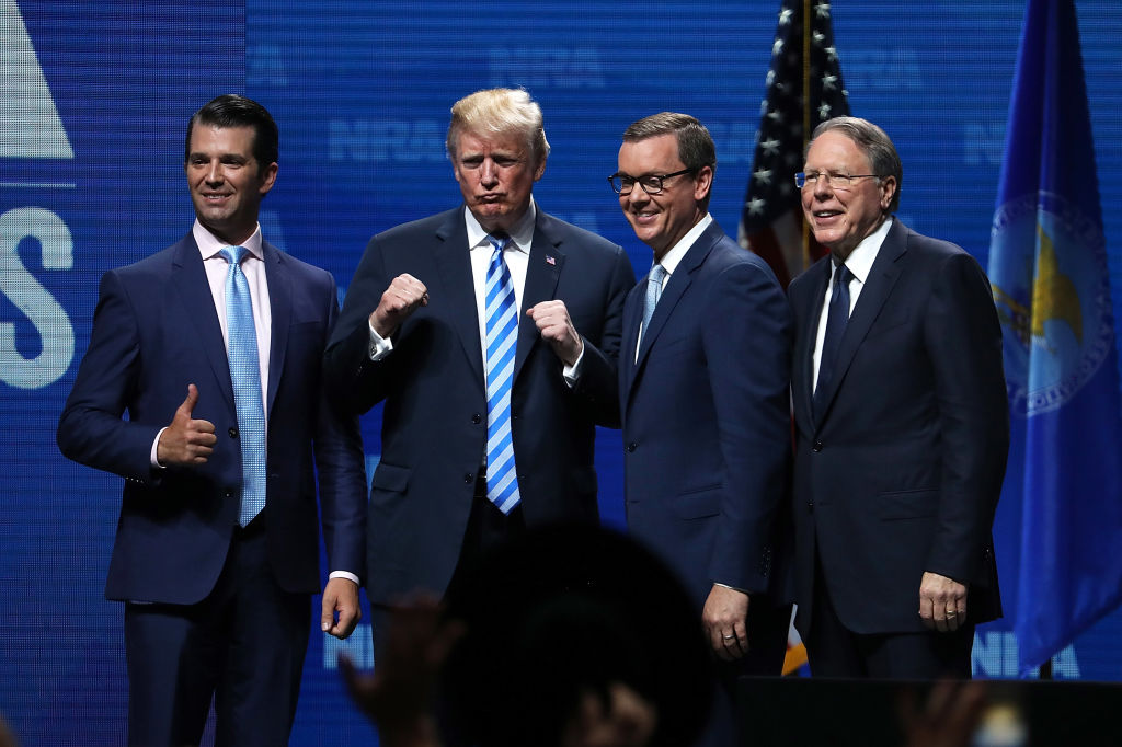 President Donald Trump, Donald Trump Jr., and the NRA’s Wayne LaPierre and Chris Cox at the National Rifle Association's annual meeting on May 4, 2018. (Justin Sullivan/Getty Images)
