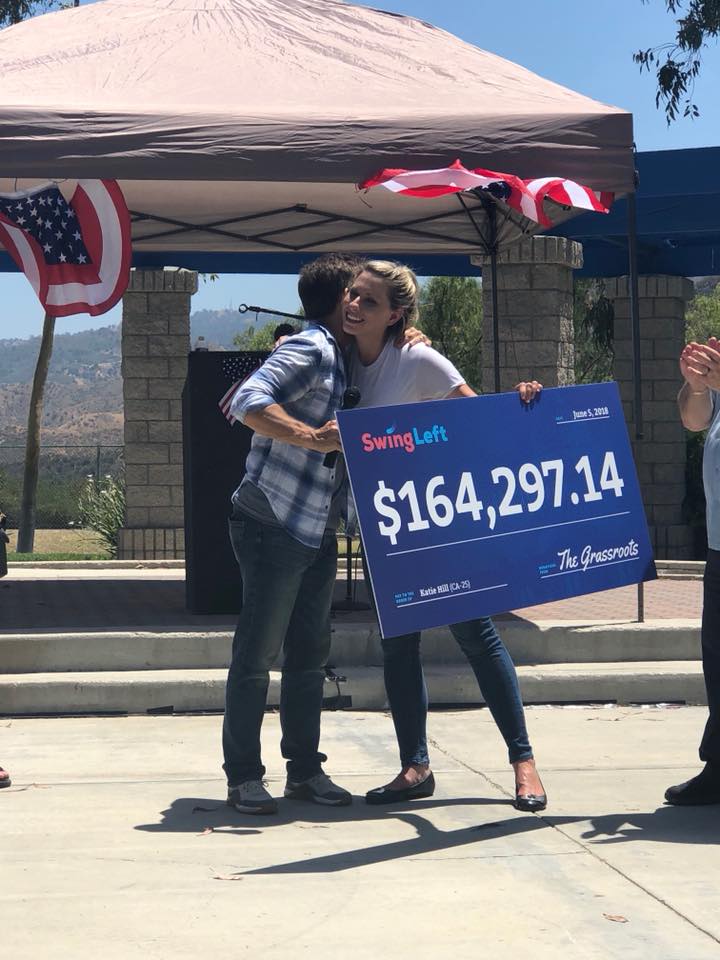 SwingLeft presents a donation check to Katie Hill. (Courtesy, Katie Hill for Congress)