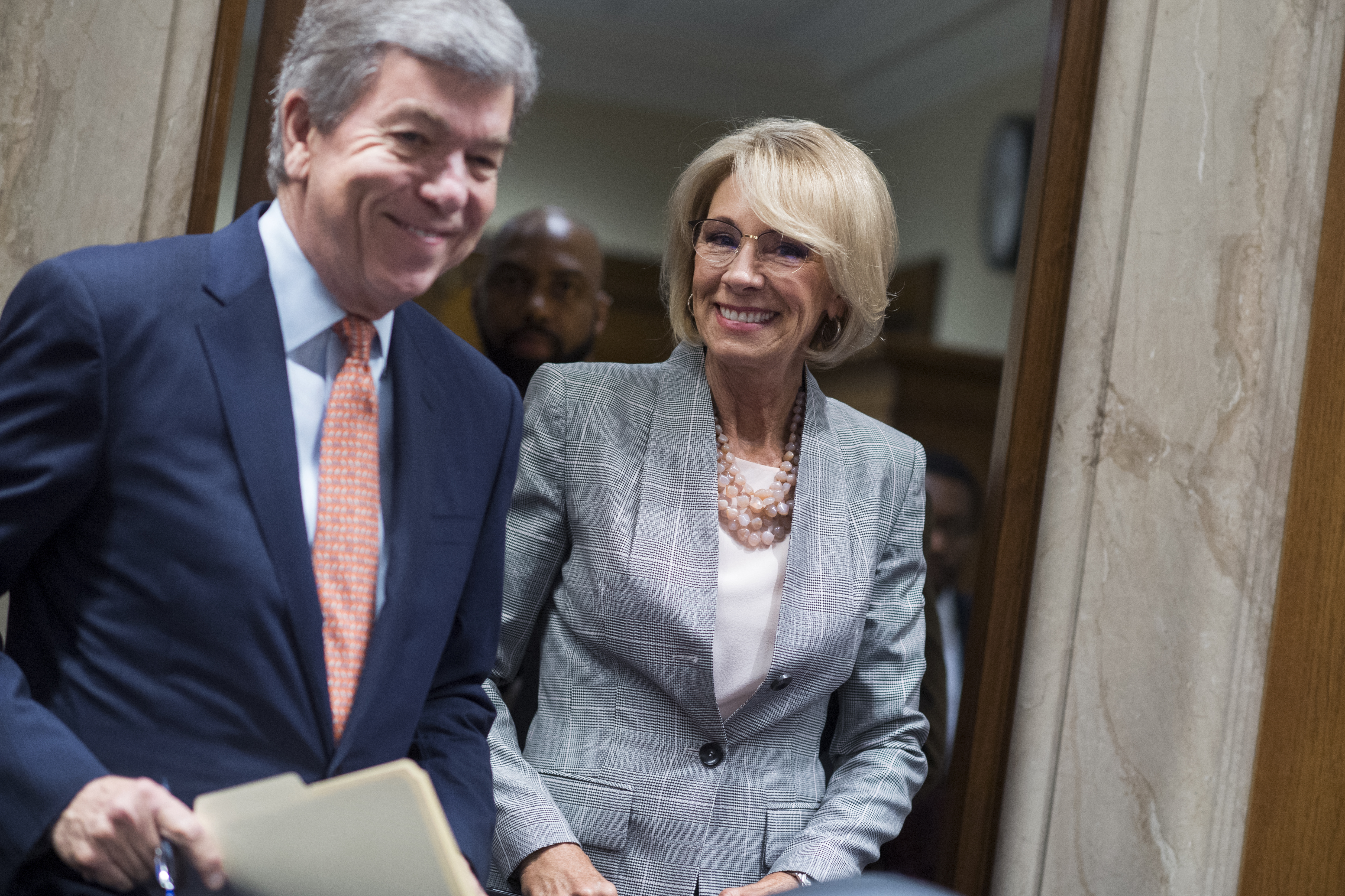Education Secretary Betsy DeVos arrives with Chairman Roy Blunt, R-Mo., before she testified at a Senate Appropriations Subcommittee in Dirksen Building on the FY2019 budget request for the Department of Education on June 5, 2018. (Credit: Tom Williams/CQ Roll Call)
