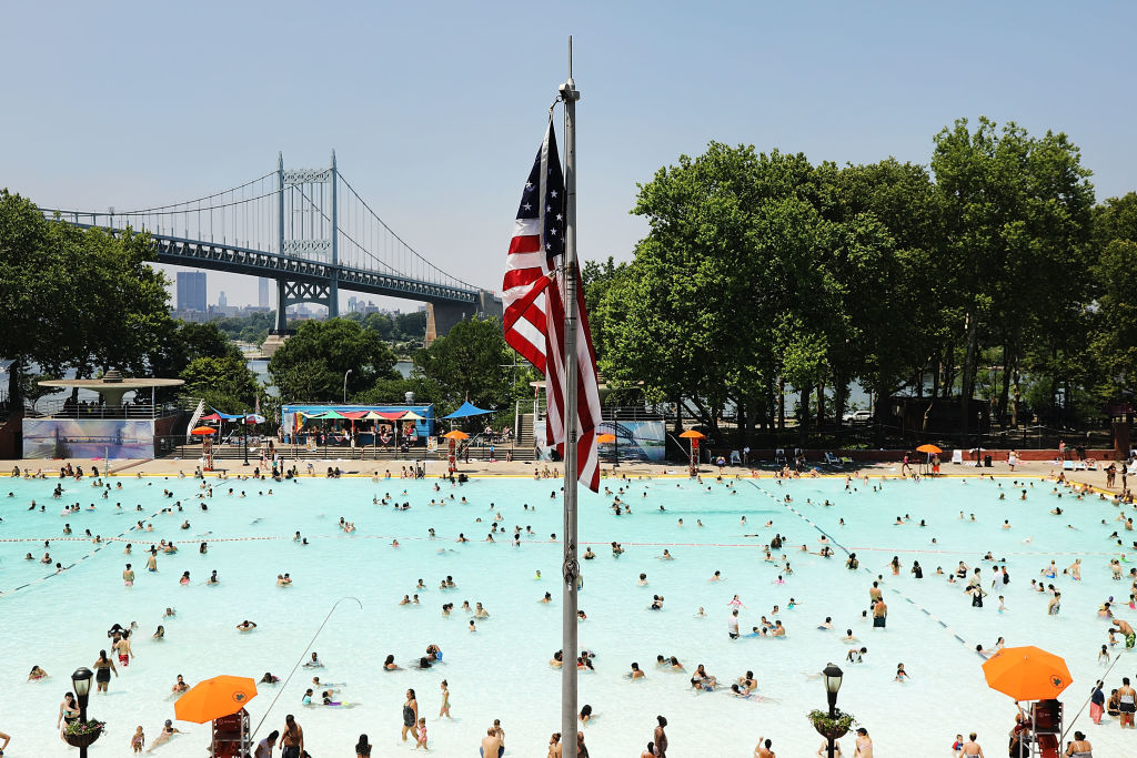 People enjoy a hot afternoon at the Astoria Pool in the borough of Queens on July 2, 2018 in New York City. New York City and much of the East Coast is experiencing higher than normal temperatures with the heat index feeling over 100 degrees. (Credit: Spencer Platt/Getty Images)