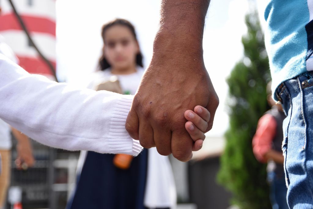 Trump administration officials say they are unable to reunite more than 900 immigrant parents with their children, after splitting them up at the U.S.-Mexico border. (Photo credit: ORLANDO ESTRADA/AFP/Getty Images)