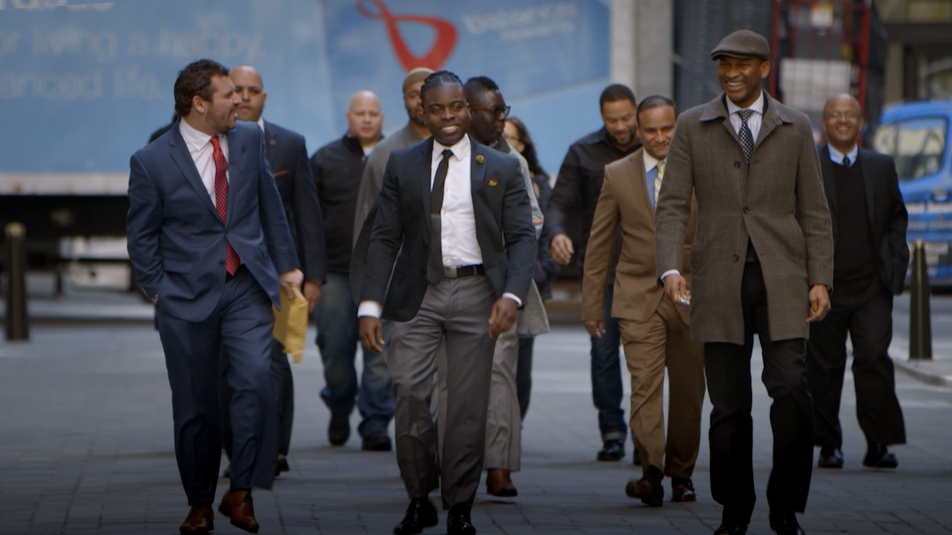 "The NYPD 12" - Julio Diaz, Pedro Serrano, Kareem Abdullah, Edwin Raymond, Derick Waller, Sandy Gonzalez; Adhyl Polanc - walk to NBC studios with their attorneys Emeka Nwokoro & John Scola , shown. (Photo by Mud Horse Pictures/Hulu)