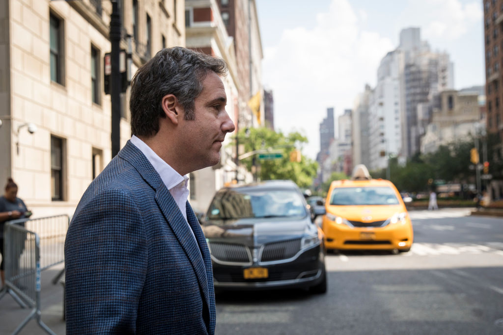 After pleading guilty to numerous counts, Michael Cohen reveals that he made hush payments at the behest of Trump. CREDIT: DREW ANGERER / GETTY
