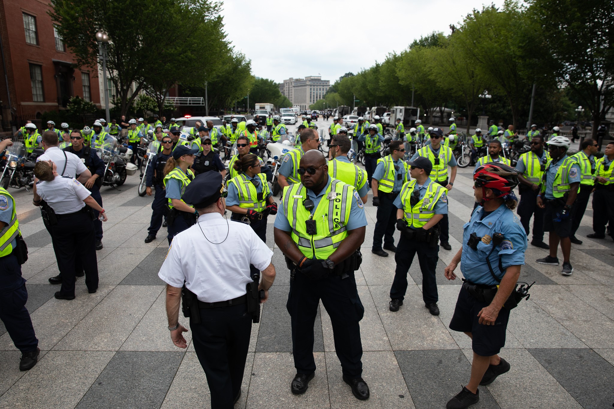 Security officials stand guard as a few white supremacists rally in D.C. (CREDIT: Yasin Ozturk/Anadolu Agency/Getty Images)