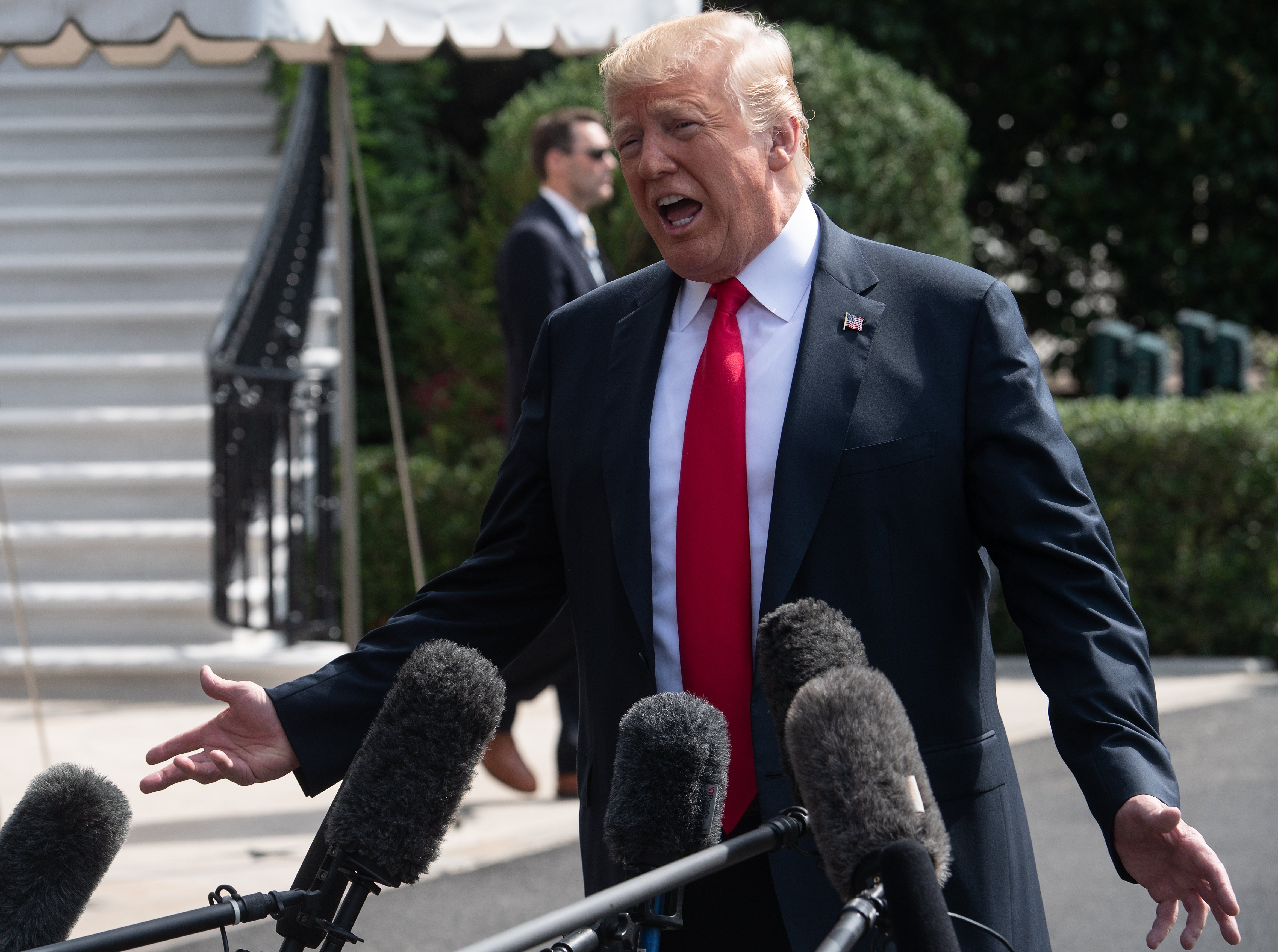 President Trump wants to "quickly" revoke the security clearance of Bruce Ohr, a Justice Department official whose wife worked for the firm which helped produce the now notorious Steele dossier outlining Trump's alleged ties to Russia. (Photo credit: NICHOLAS KAMM/AFP/Getty Images)