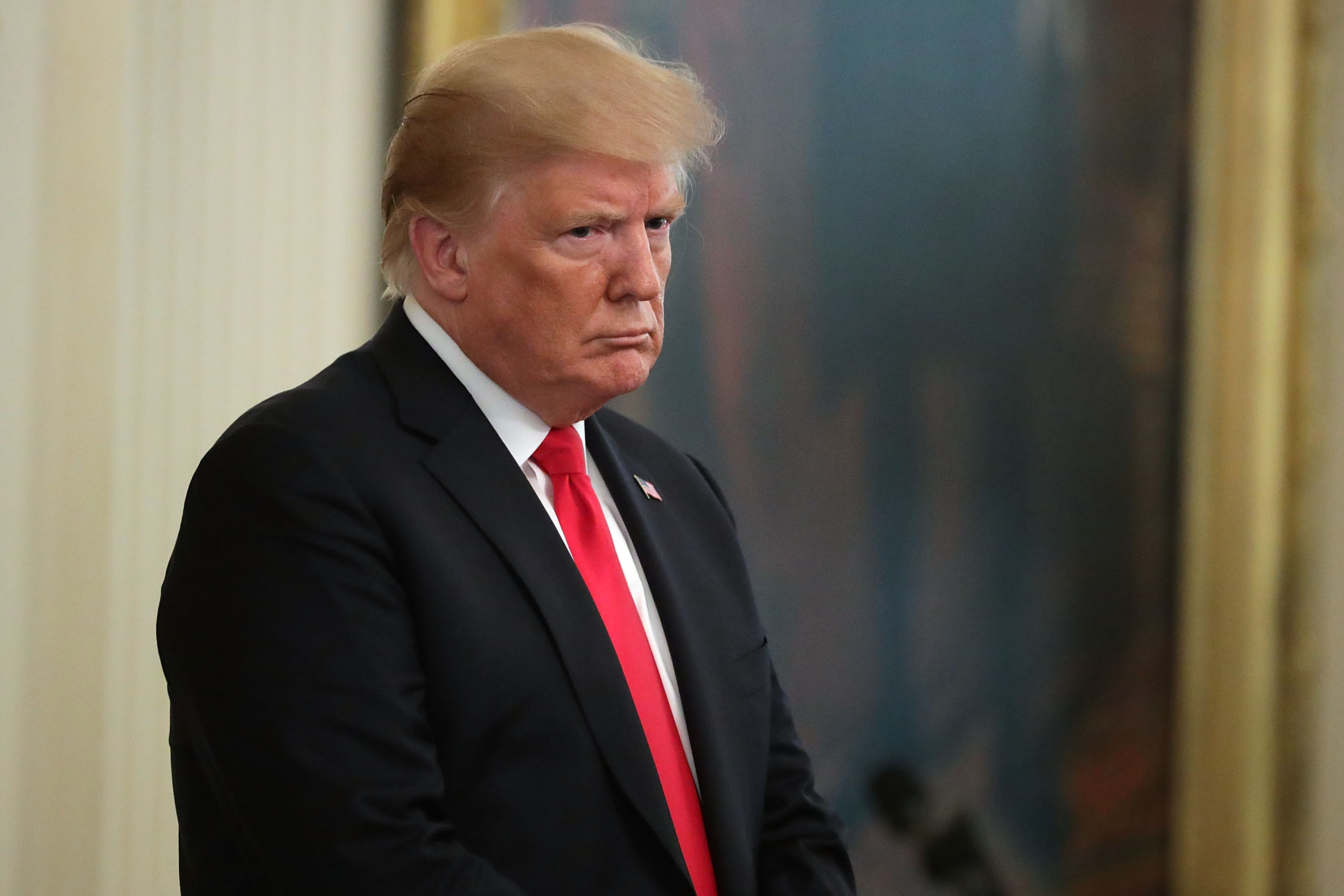 FILE PICTURE: President Donald Trump listens to the opening prayer during Air Force Technical Sergeant John Chapman's Medal of Honor ceremony at the White House August 22, 2018 in Washington, DC. (Photo by Chip Somodevilla/Getty Images)
