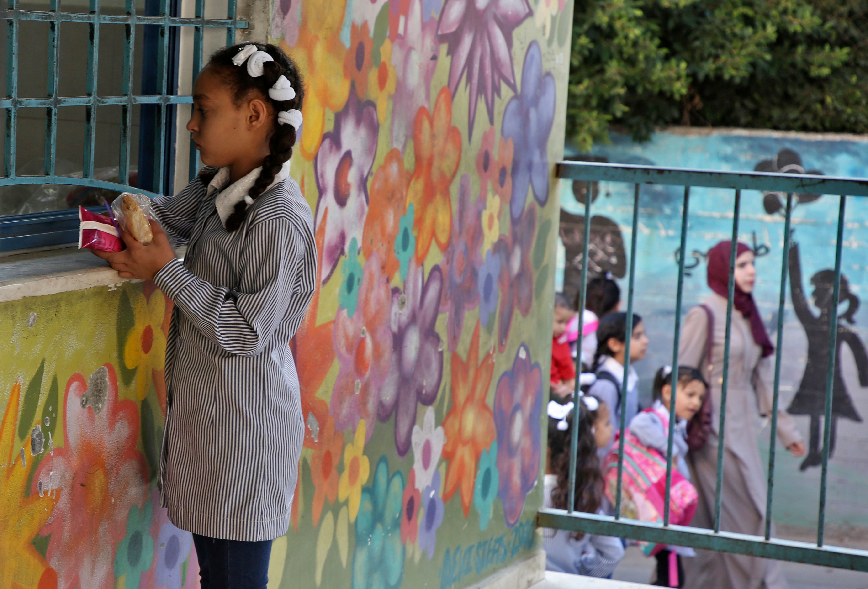 Children return to school at an establishment run by United Nations Agency for Palestinian Refugees (UNRWA) in Balata refugee camp, east of Nablus in the occupied West Bank on August 29, 2018, on the first day of classes after the summer holidays. CREDIT: Jaafar Ashitiyeh/AFP/Getty Images.
