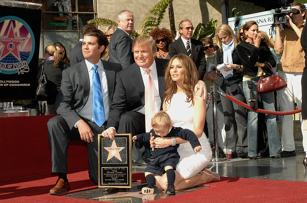 Donald Trump posing with is wife Melania Trump, baby son Baron Trump and Donald Trump Jr. (L), at the star ceremony honoring him on the Hollywood Walk of Fame. CREDIT: Frank Trapper/Corbis via Getty Images