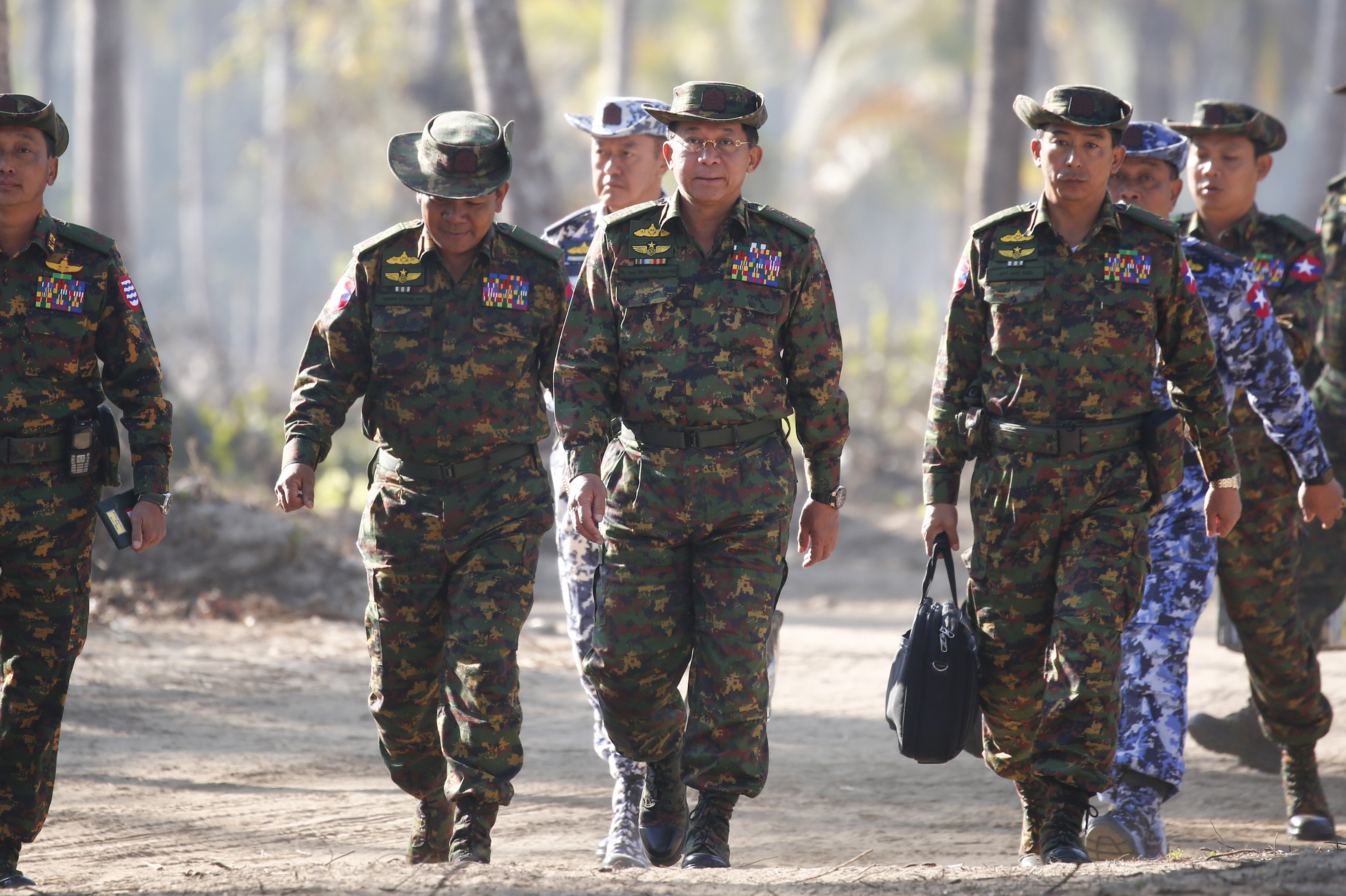 Myanmar military commander-in-chief Senior General Min Aung Hlaing (C) is seen with senior military commanders. The general is one of several military members or groups banned from Facebook this week, following a UN report highlighting genocide by the Burmese military against Rohingya Muslims in the country.
(Photo credit: LYNN BO BO/AFP/Getty Images)