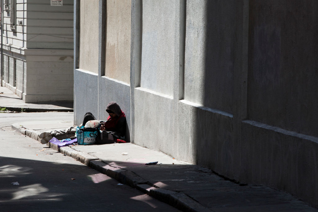 SAN FRANCISCO, CA - APRIL 17: A homeless man leans against a building in an alley in the Mission district, on April 17, 2018 in San Francisco, California. The city doesn't have enough beds for the approximately 7,000 homeless who stay here. (Photo by Melanie Stetson Freeman/The Christian Science Monitor via Getty Images)