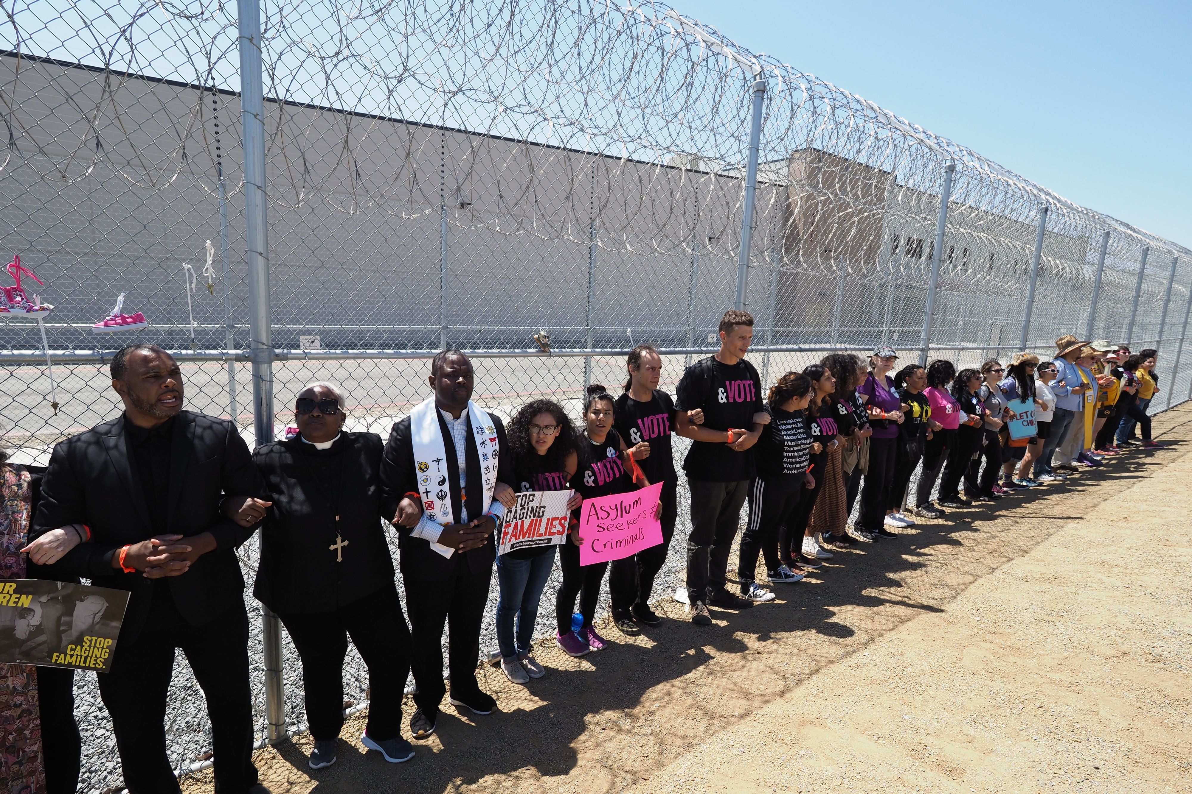 Dozens of protesters descended on Nashville, Tennessee Monday to block the entrance of CoreCivic, a private prison company that contracts with the federal government to detain immigrants. PICTURED ABOVE: The Otay Mesa Detention Center, owned and operated by CoreCivic, has an inmate population that includes detainees of the U.S. Immigration and Customs Enforcement agency. (Photo credit: Robyn Beck / AFP)