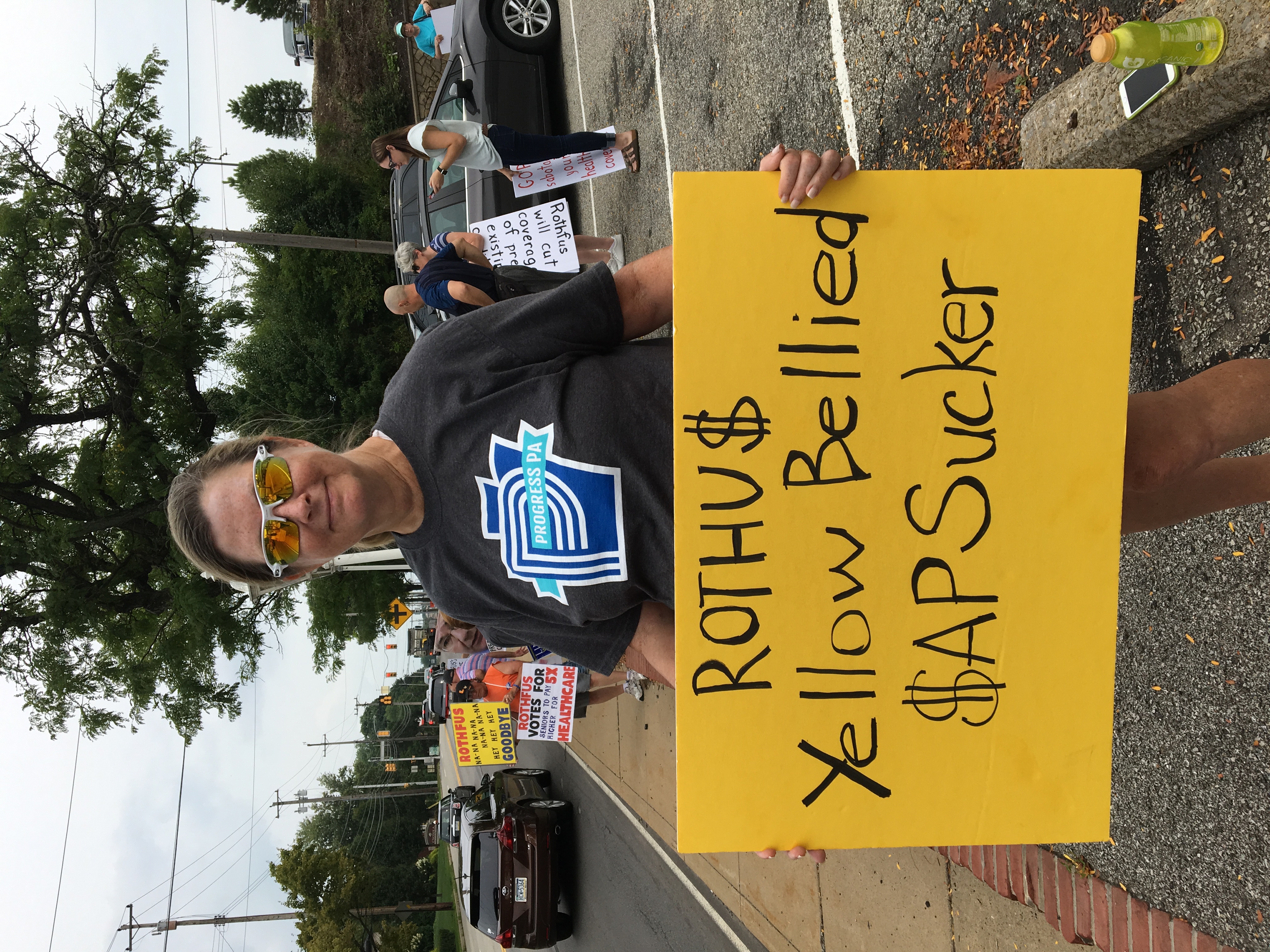 Stacey Vernallis holds her sign at the rally. (Elham Khatami/ThinkProgress)