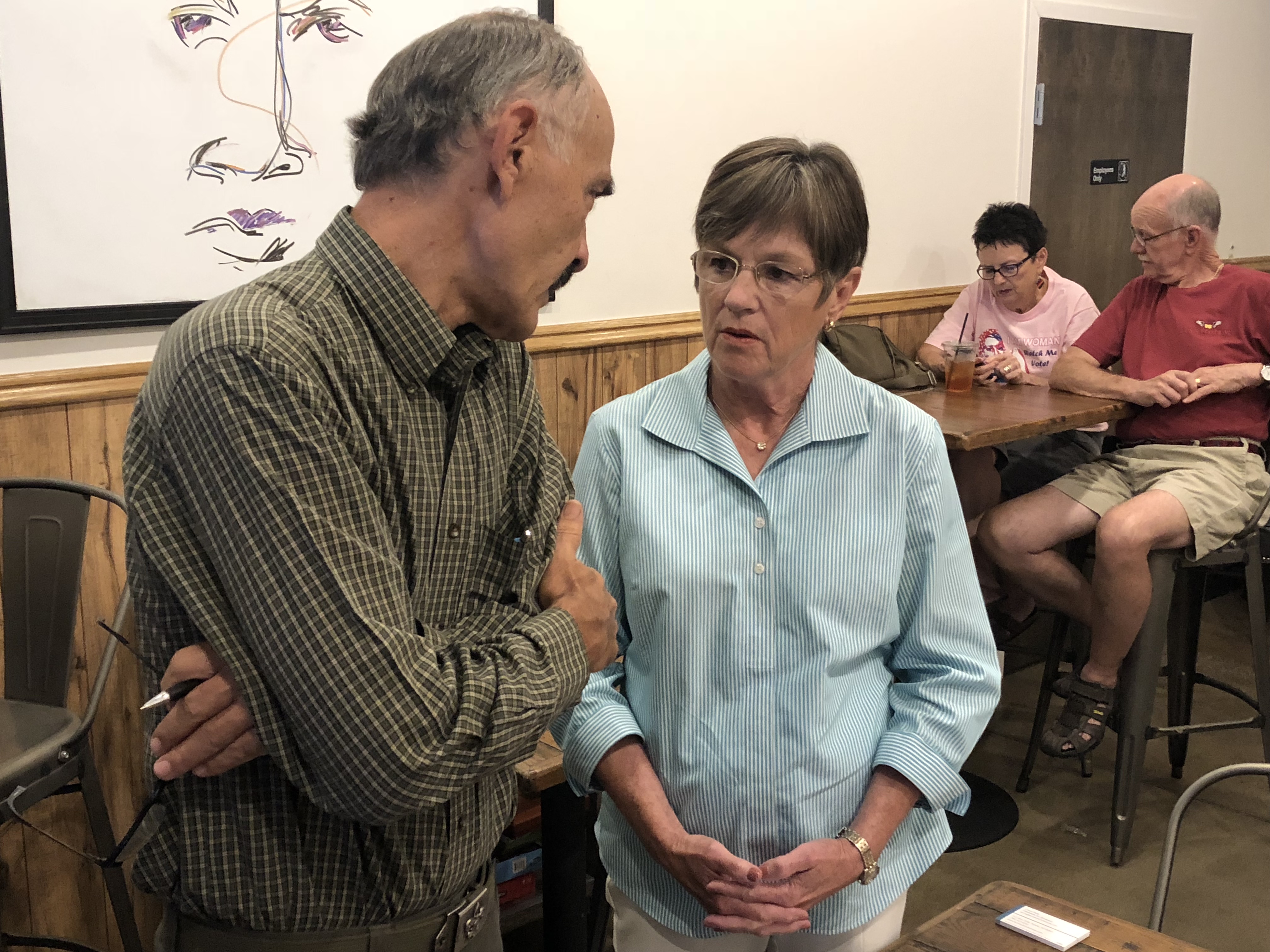 Laura Kelly talks to a voter during a campaign stop in Lenexa, Kansas. CREDIT: Kira Lerner