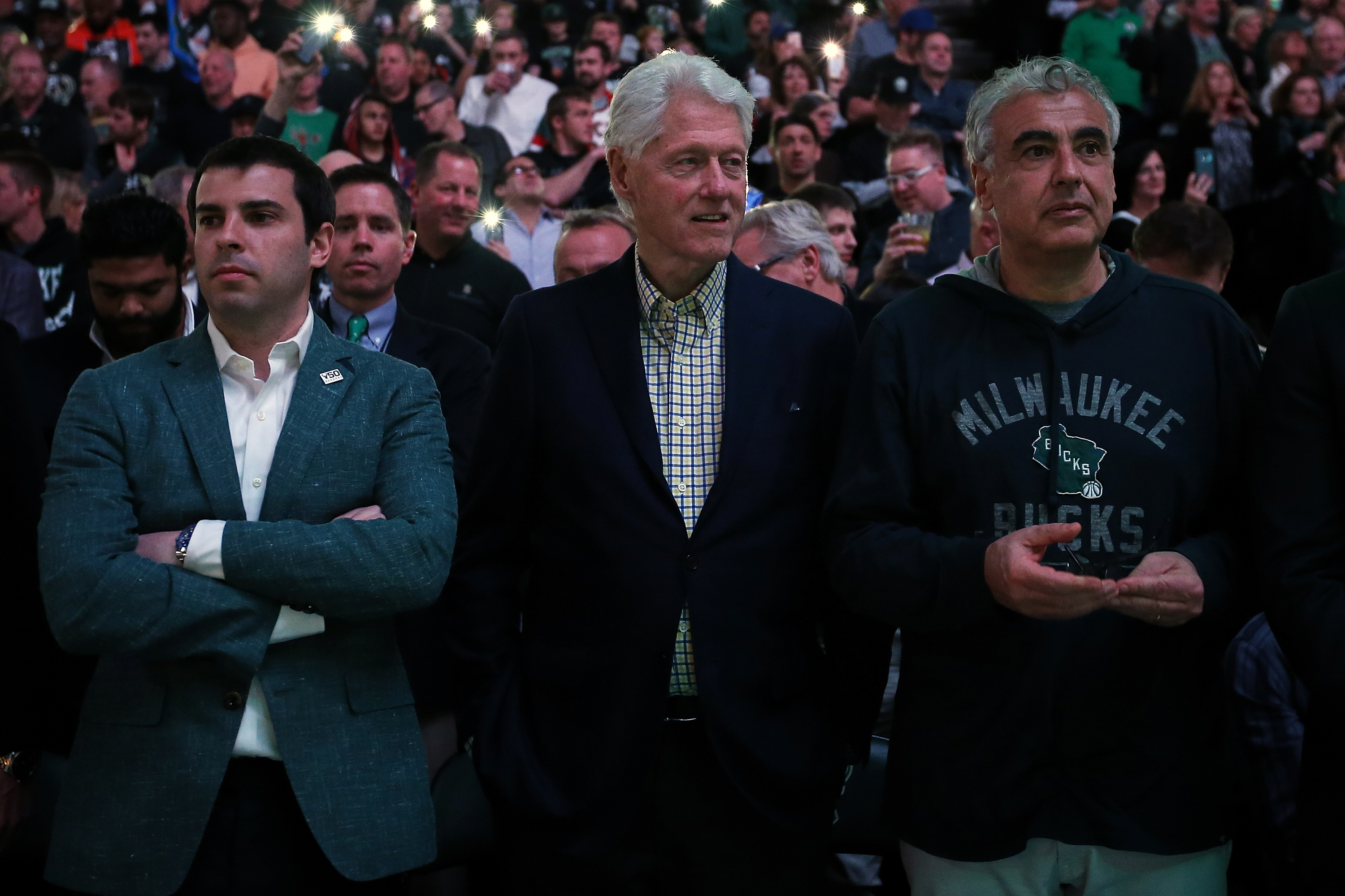 Former President Bill Clinton and Milwaukee Bucks owner Marc Lasry (right) look on before game six of round one of the 2018 NBA Playoffs between the Milwaukee Bucks and Boston Celtics on April 26, 2018 in Milwaukee. CREDIT: Dylan Buell/Getty Images