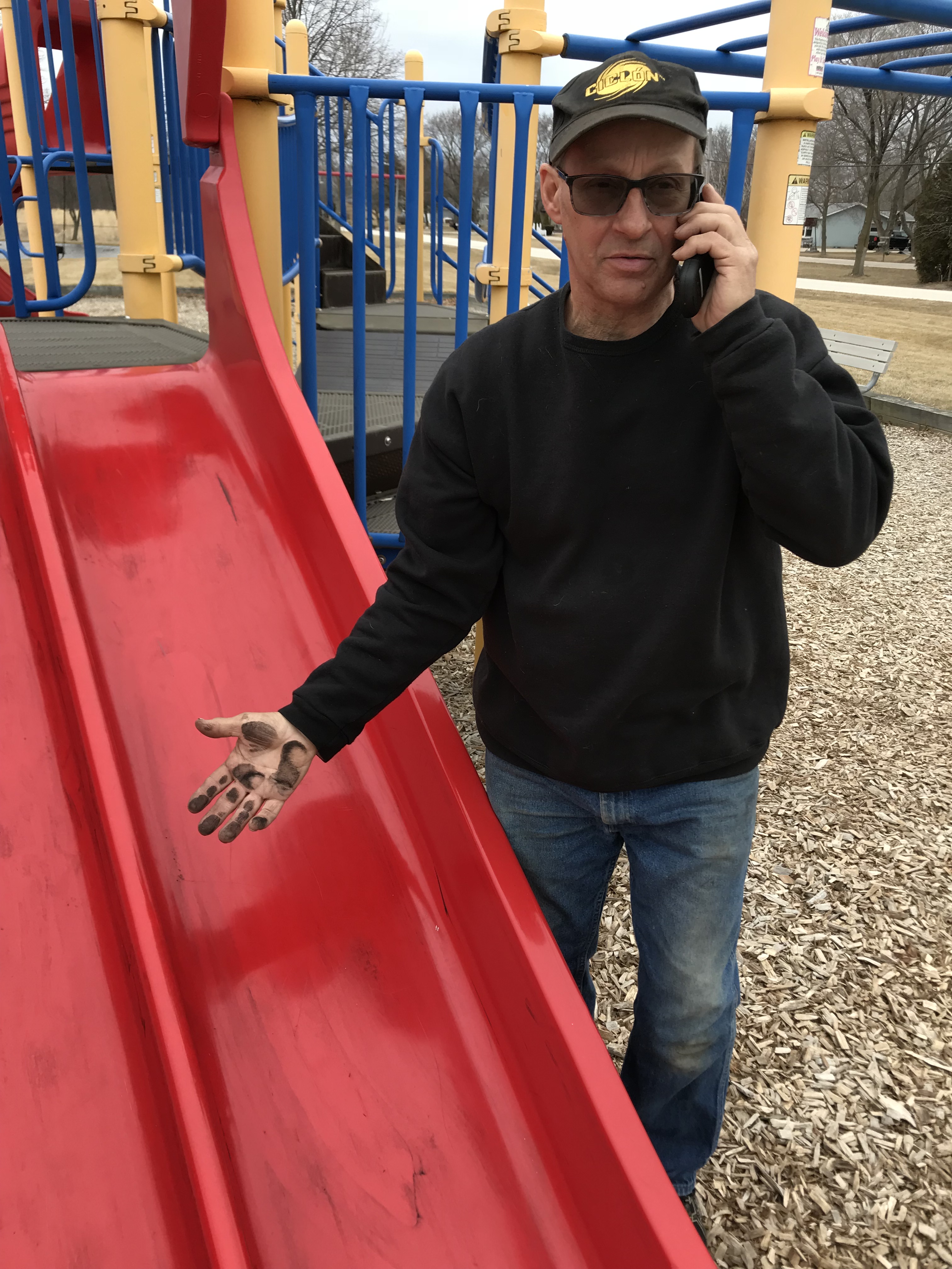 Oak Creek, Wisconsin resident Greg Millard, with his hand covered in coal dust, after a major coal dust event on March 5, 2018. CREDIT: MIRANDA EHRLICH/CLEAN POWER COALITION OF SOUTHEAST WISCONSIN