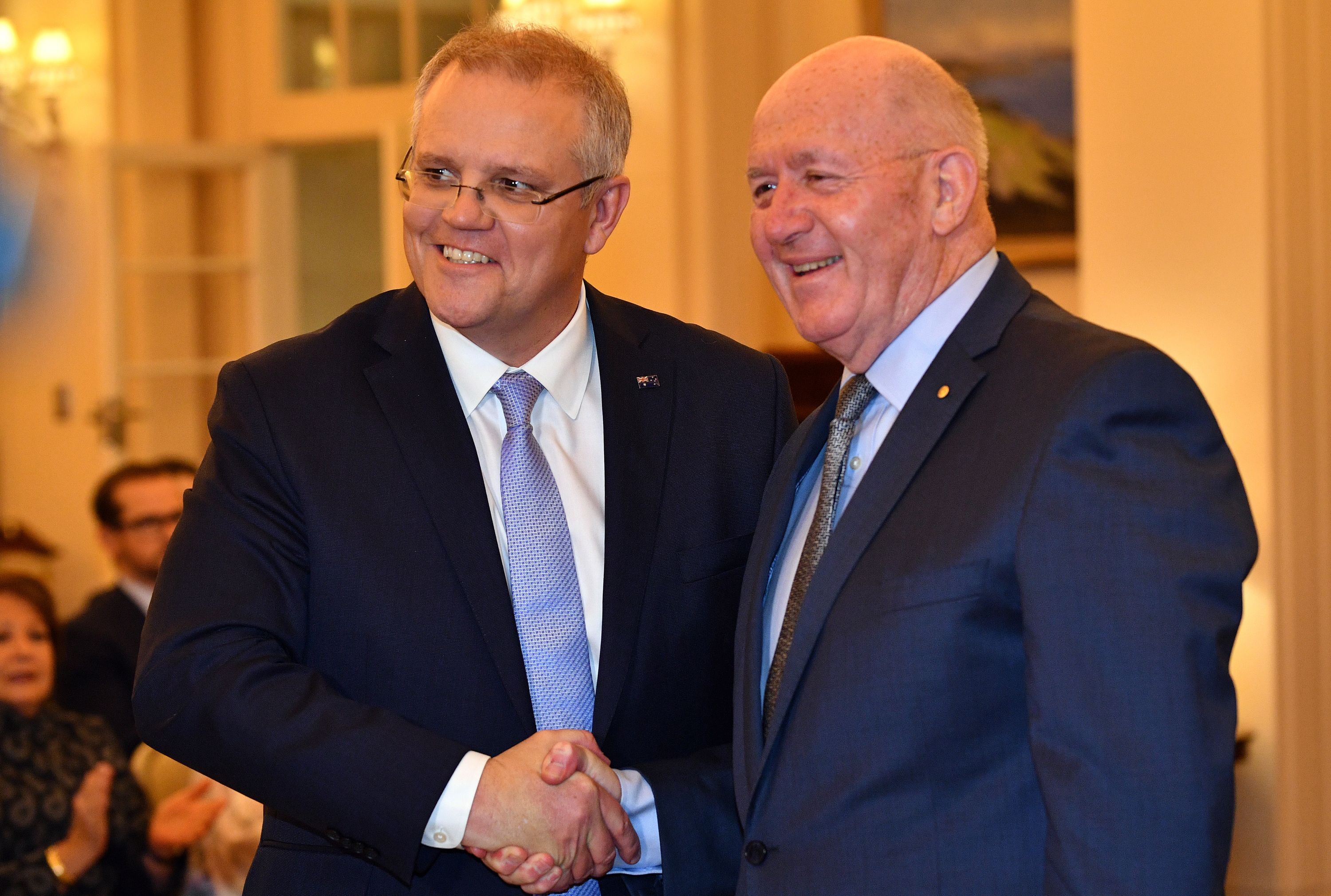 Australia's Governor General Peter Cosgrove (right) congratulates new Australian Prime Minister Scott Morrison after the latter was sworn into office in Canberra on August 24, 2018. SAEED KHAN/AFP/Getty Images
